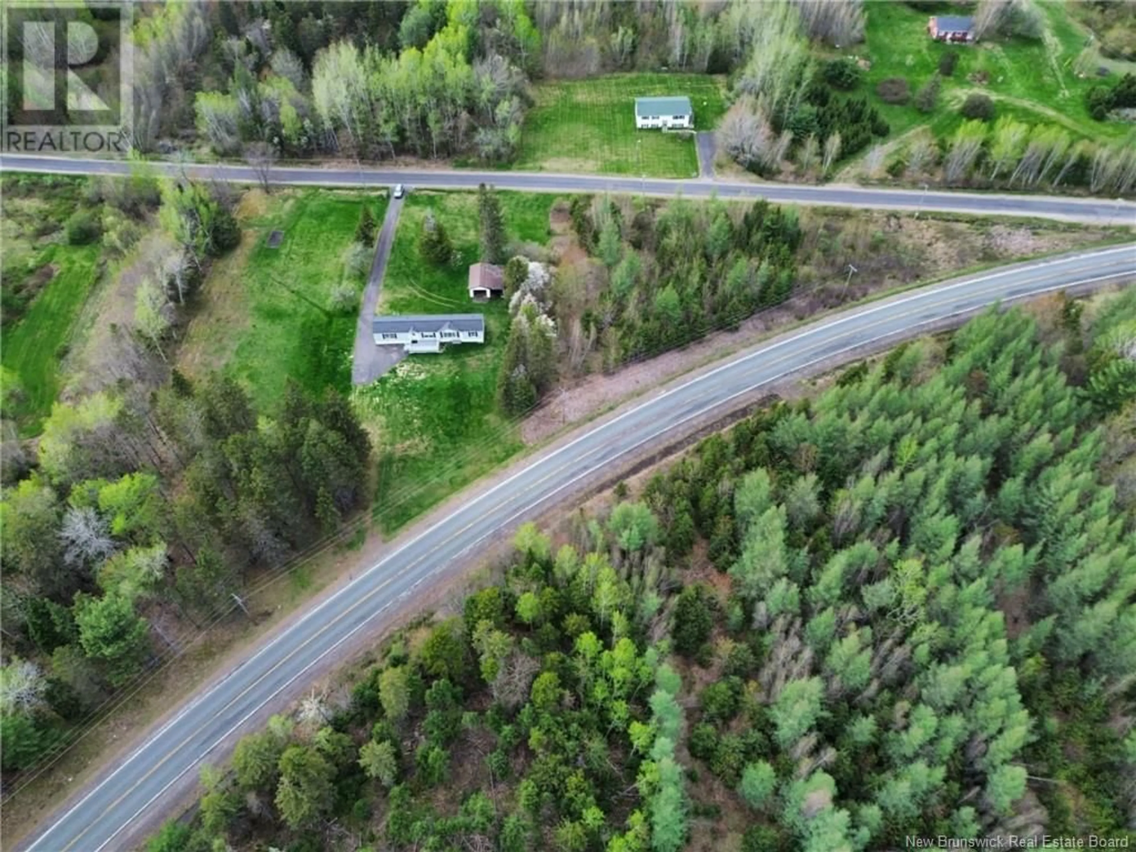 A pic from outside/outdoor area/front of a property/back of a property/a pic from drone, unknown for 19 COX POINT ROAD, Cumberland Bay New Brunswick E4A2X1