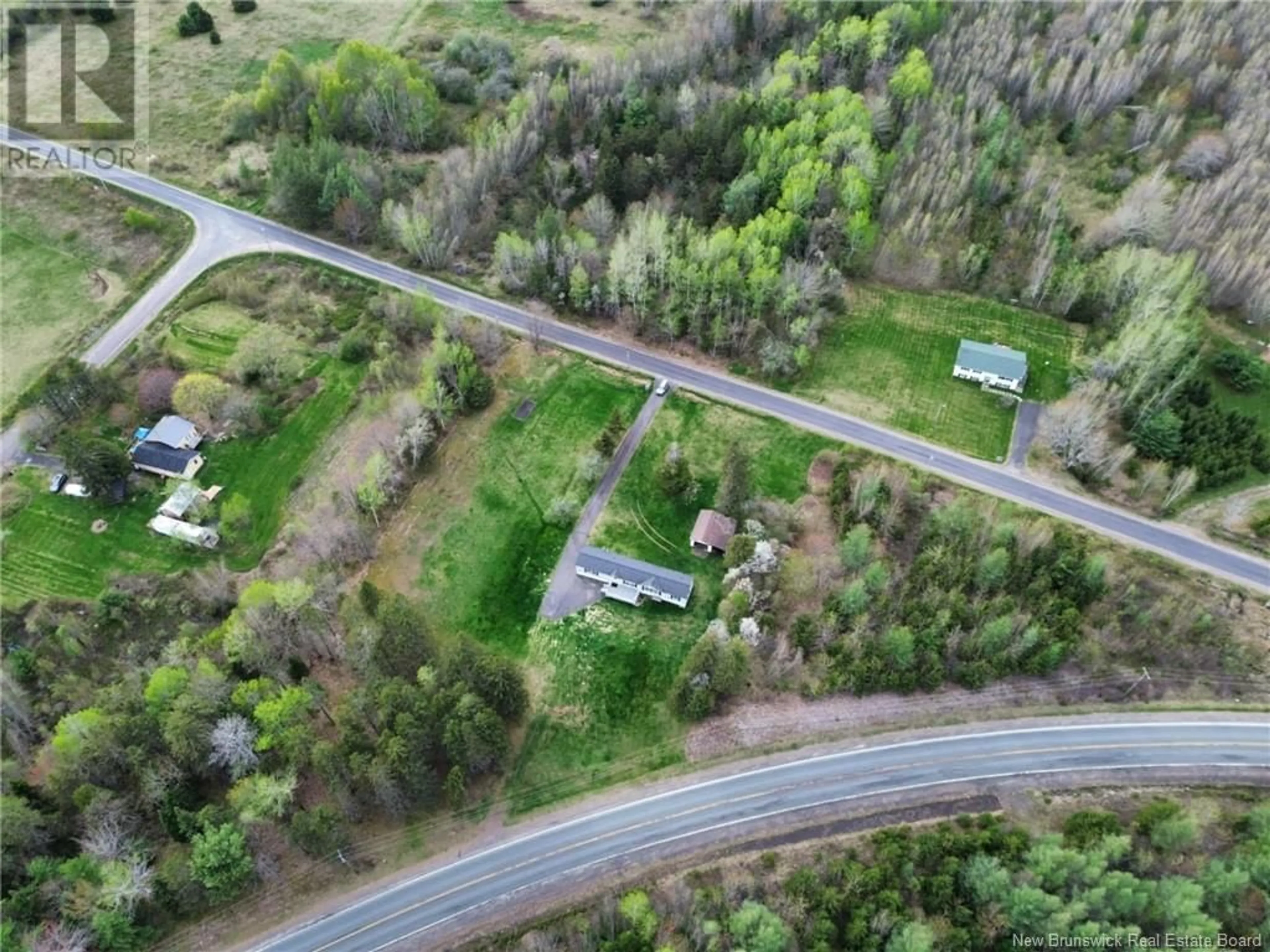 A pic from outside/outdoor area/front of a property/back of a property/a pic from drone, street for 19 COX POINT ROAD, Cumberland Bay New Brunswick E4A2X1