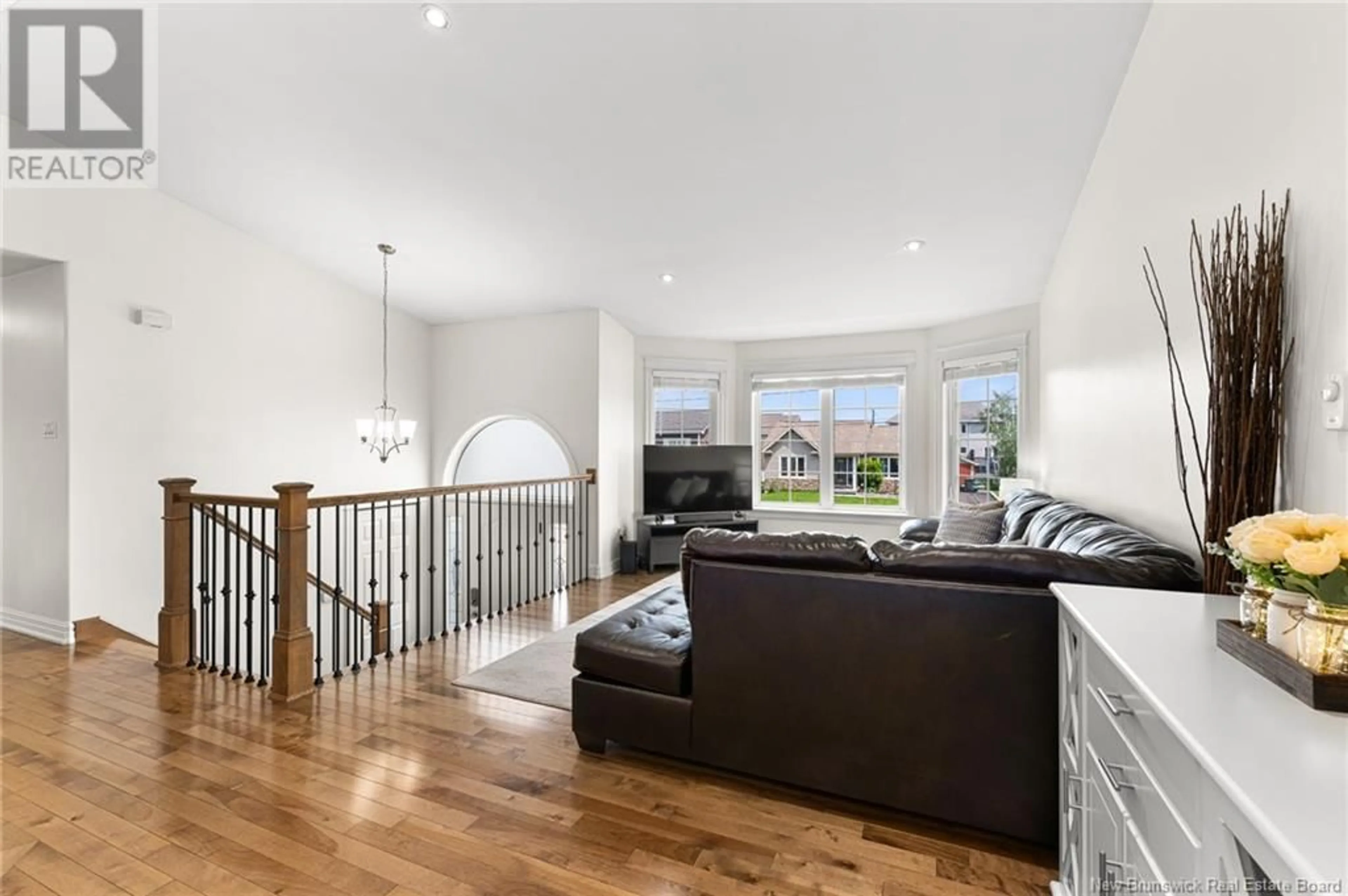 Living room with furniture, wood/laminate floor for 59 MILLWOOD DRIVE, Riverview New Brunswick E1B0B6