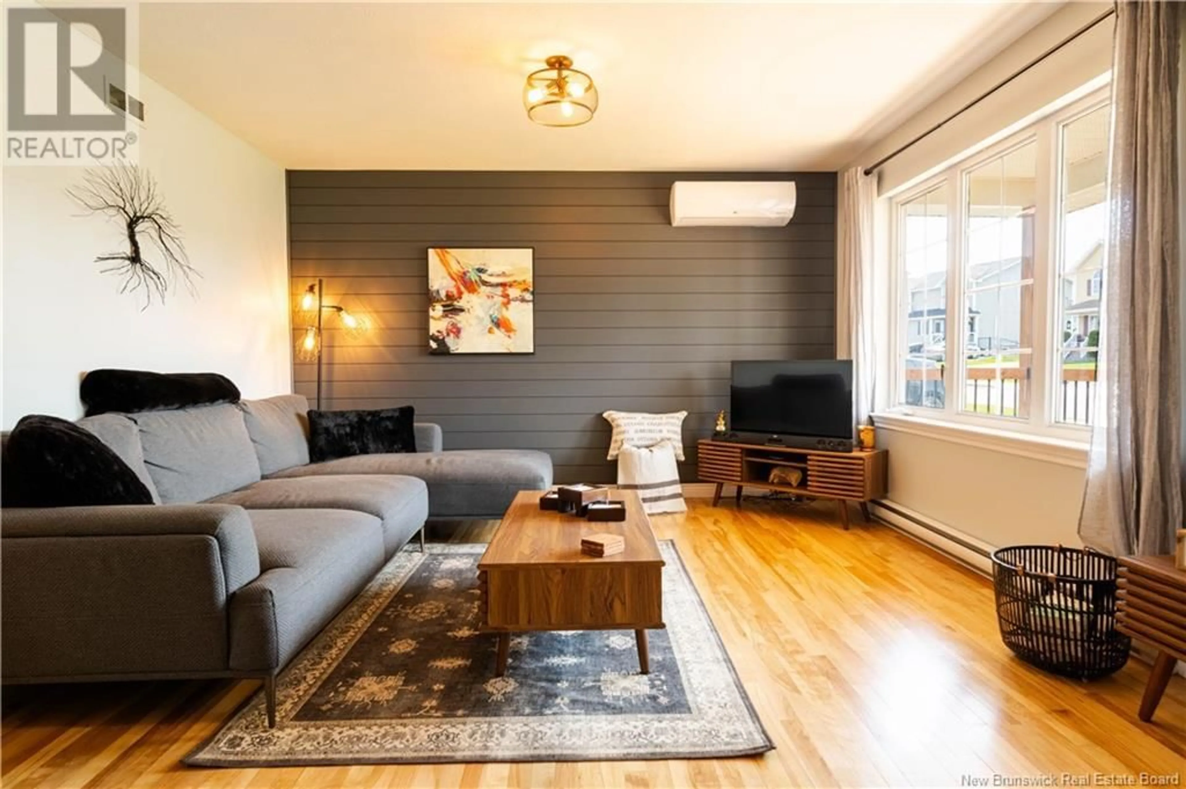 Living room with furniture, wood/laminate floor for 48 SAWGRASS DRIVE, Riverview New Brunswick E1B0A8