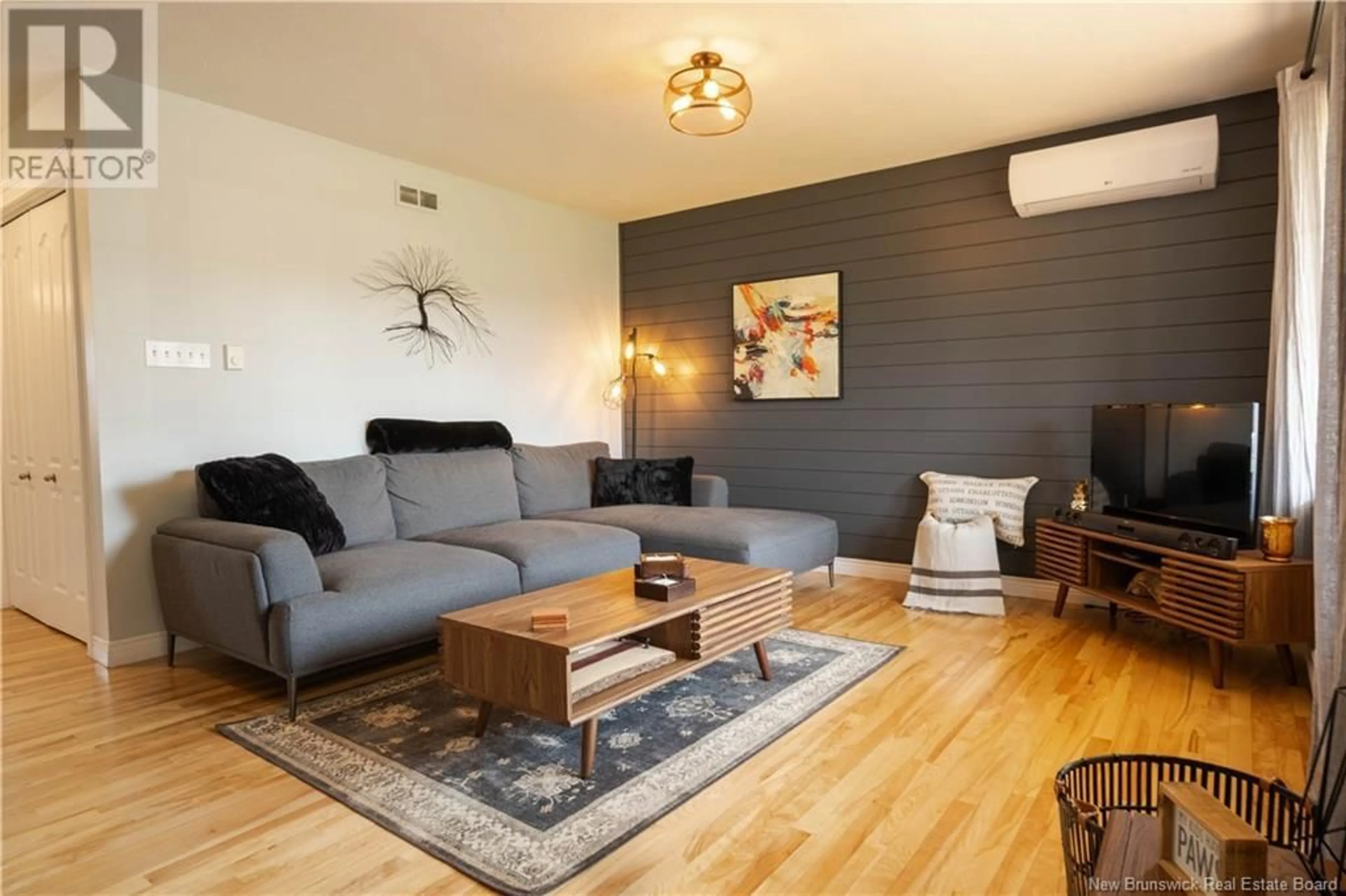Living room with furniture, wood/laminate floor for 48 SAWGRASS DRIVE, Riverview New Brunswick E1B0A8