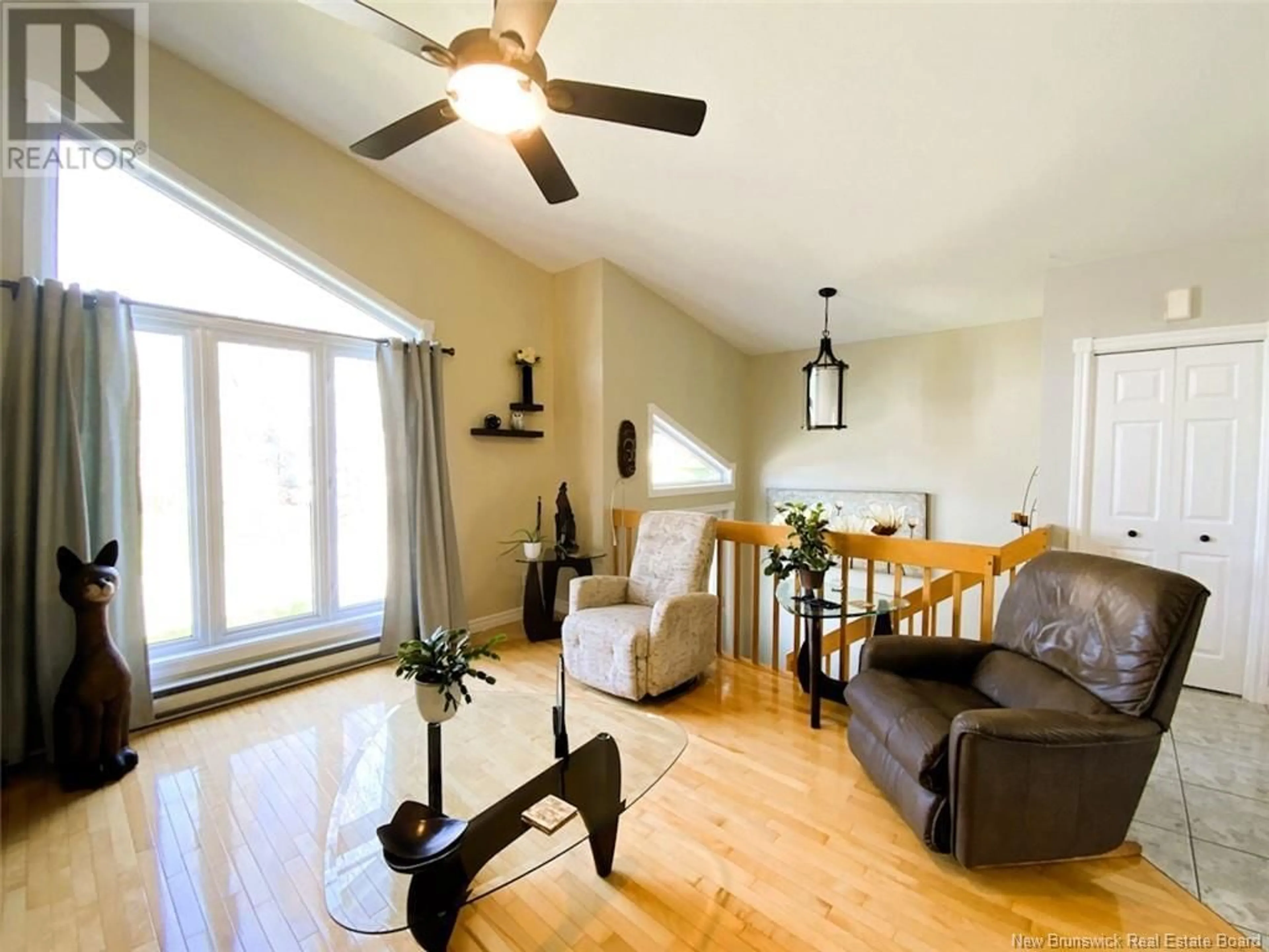 Living room with furniture, wood/laminate floor for 133 BELISLE AVENUE, Edmundston New Brunswick E3V4C7