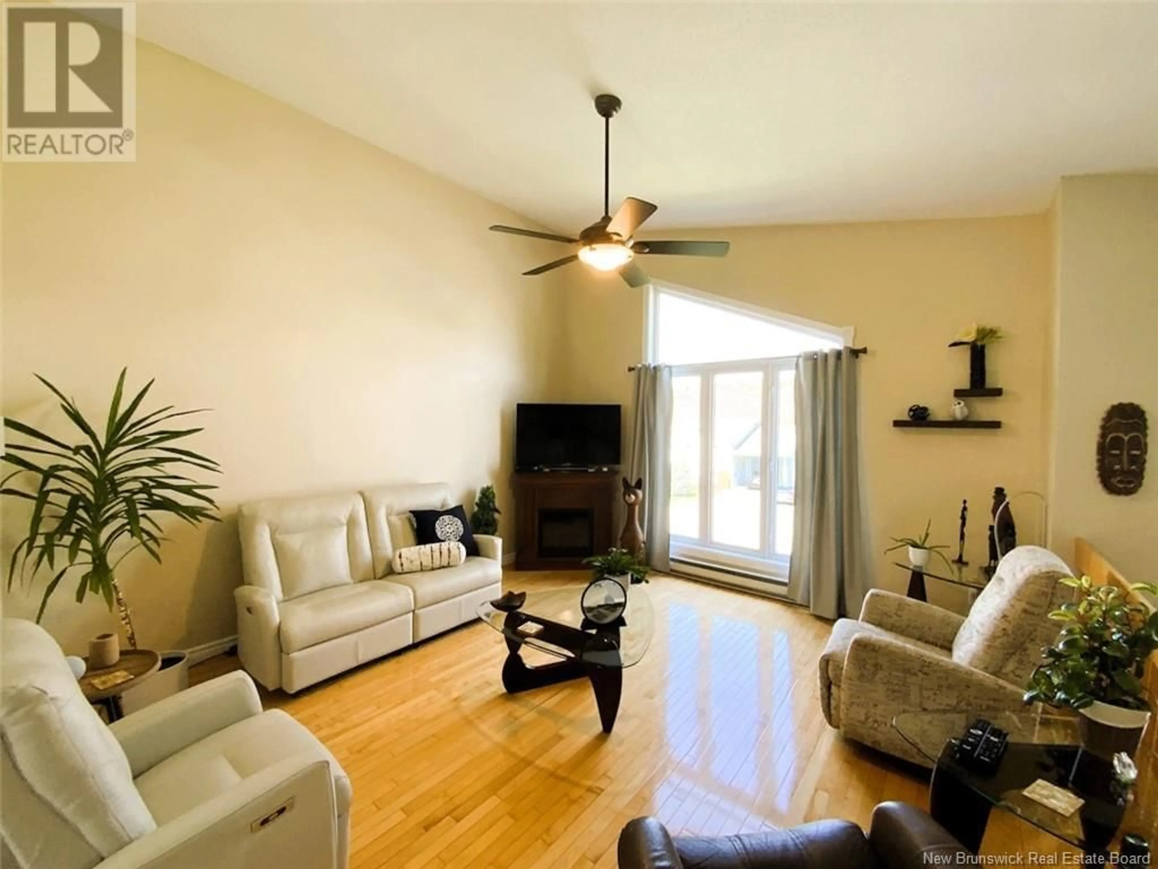 Living room with furniture, wood/laminate floor for 133 BELISLE AVENUE, Edmundston New Brunswick E3V4C7