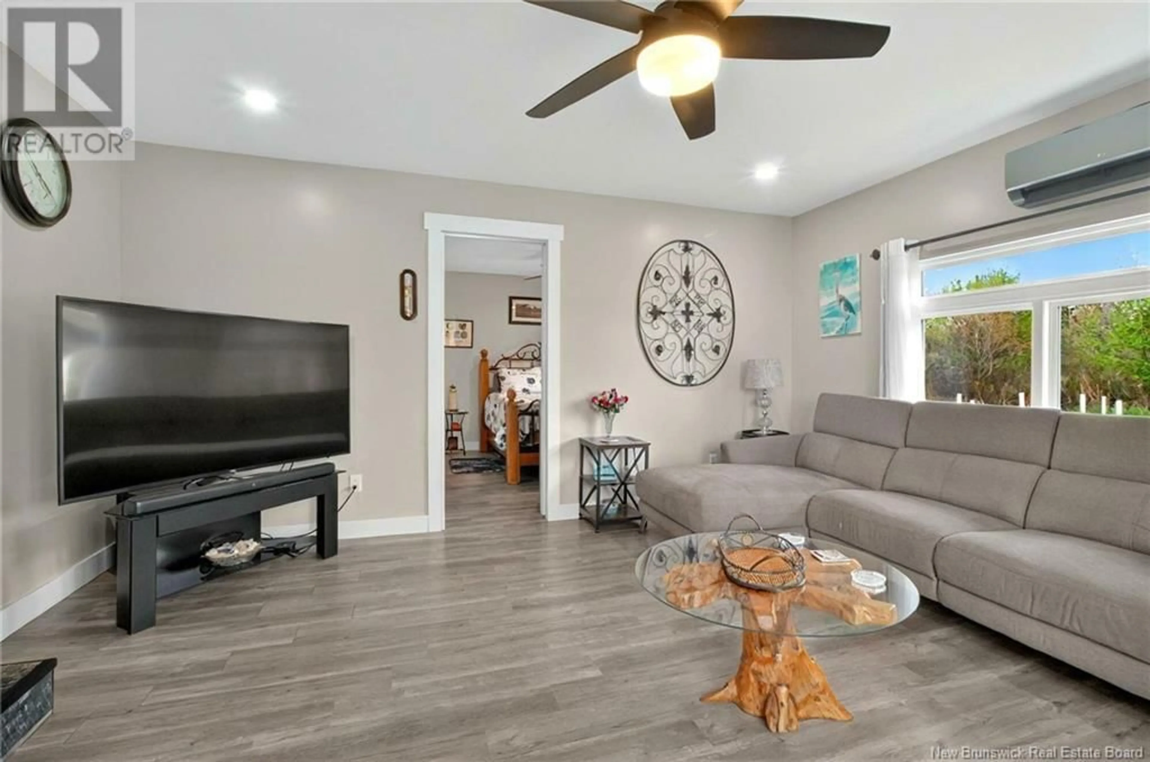 Living room with furniture, wood/laminate floor for 15 CÔTE D'OR CRESCENT, Trois Ruisseaux New Brunswick E4N2V4