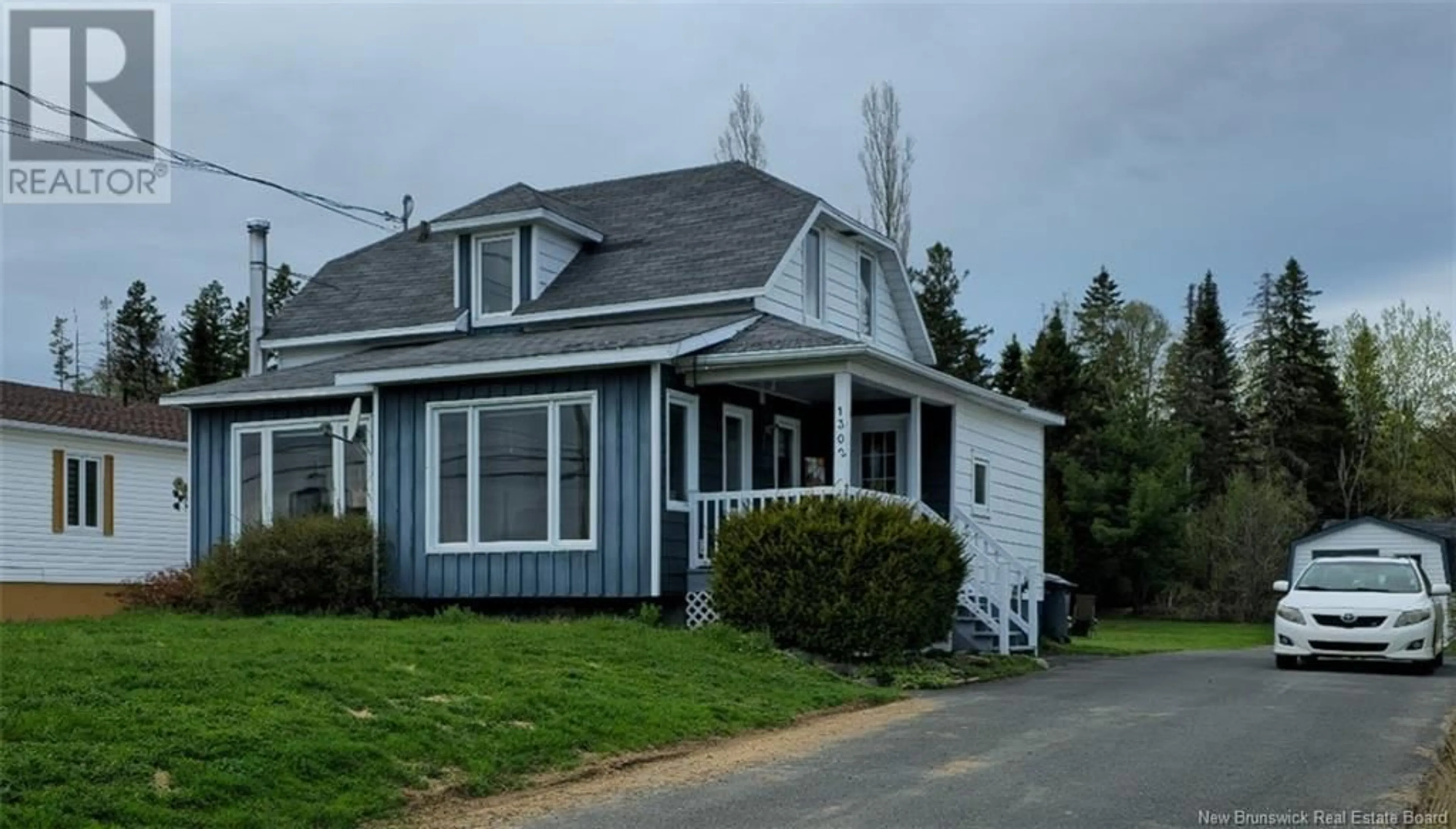 Home with vinyl exterior material, street for 1302 ROBERTVILLE, Robertville New Brunswick E8K2R8