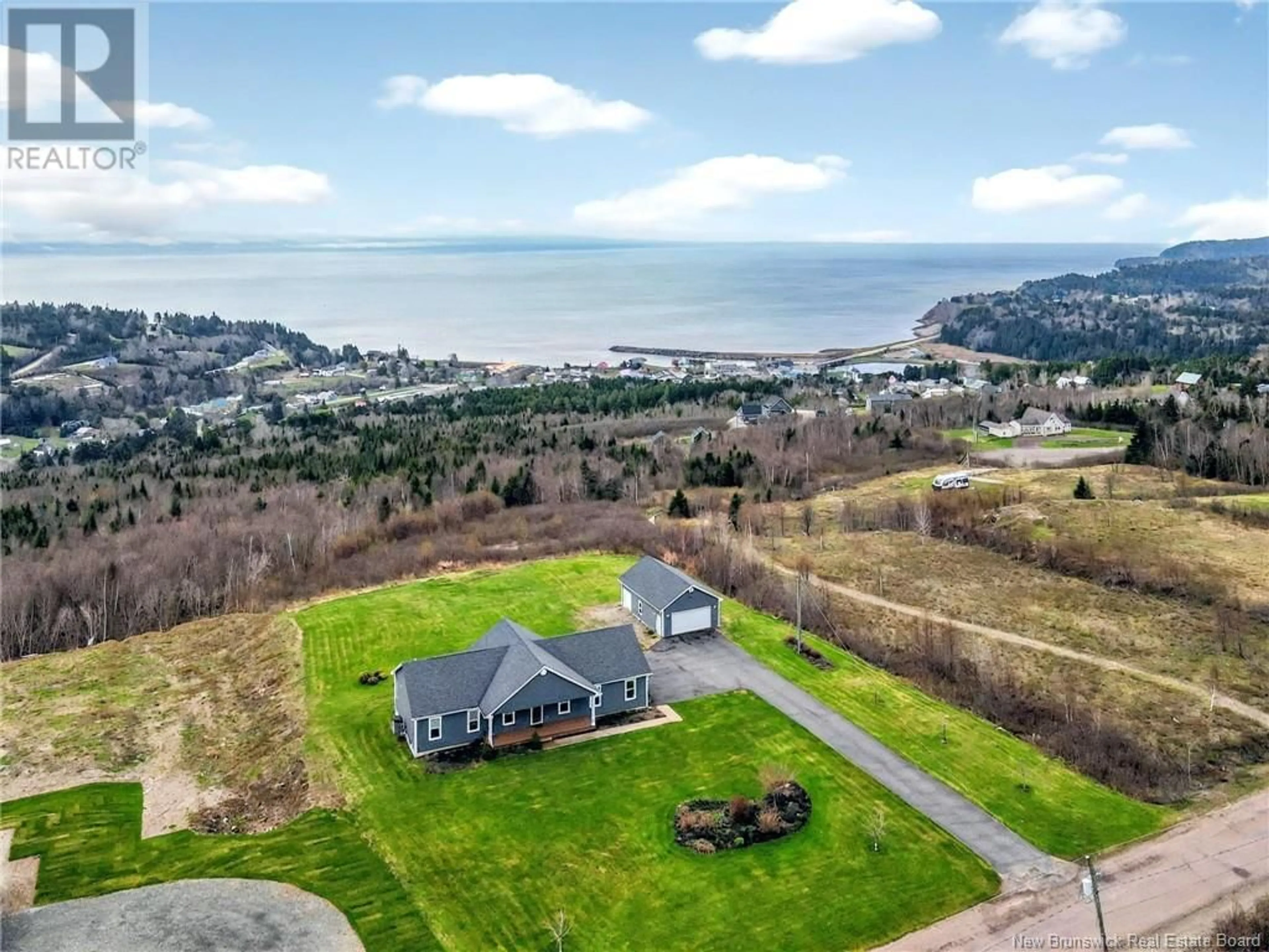 A pic from outside/outdoor area/front of a property/back of a property/a pic from drone, water/lake/river/ocean view for 180 SCHOOL STREET, Alma New Brunswick E4H0A3