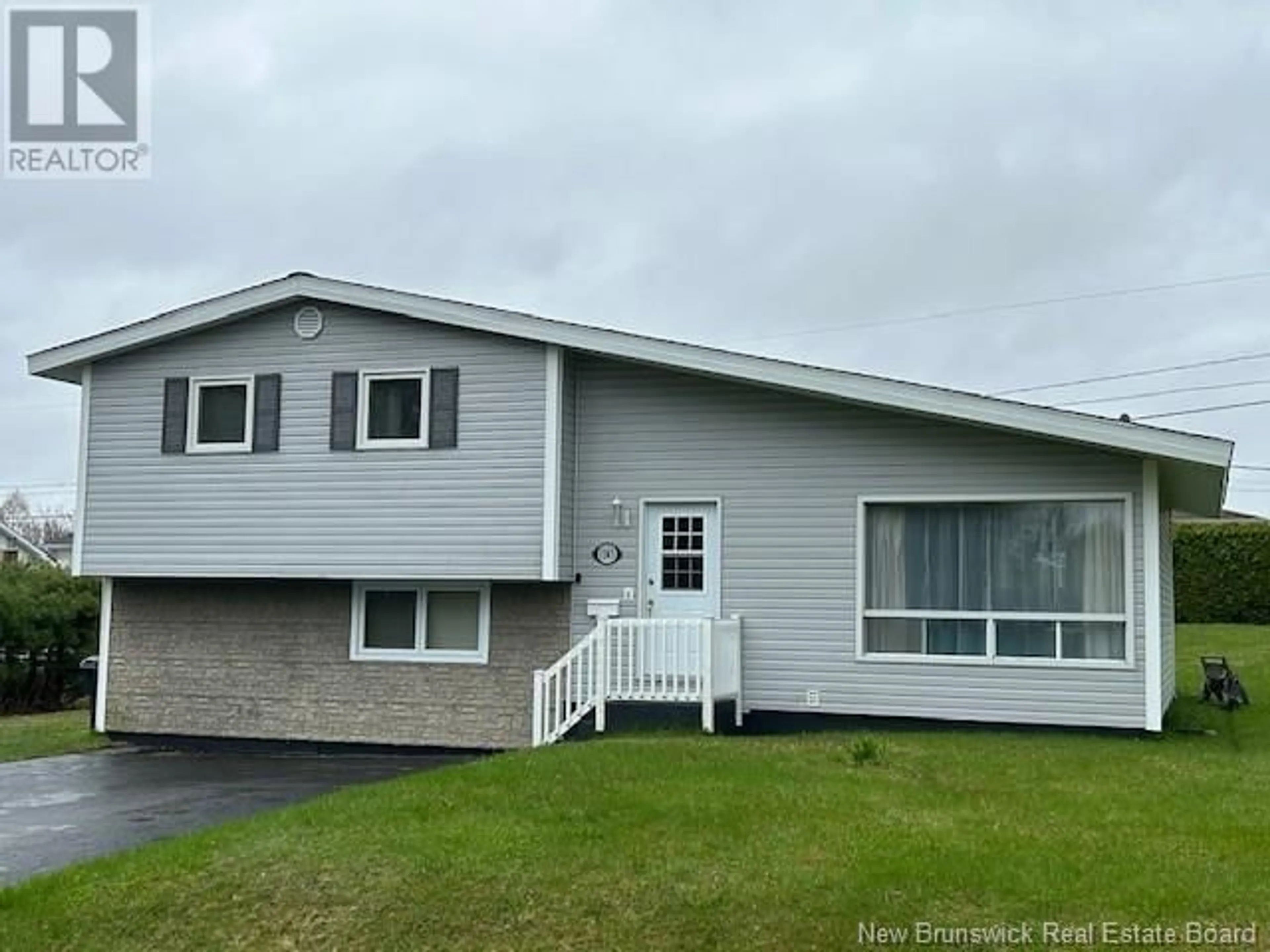 Home with vinyl exterior material, street for 1145 ULRIC DRIVE, Bathurst New Brunswick E2A3X9