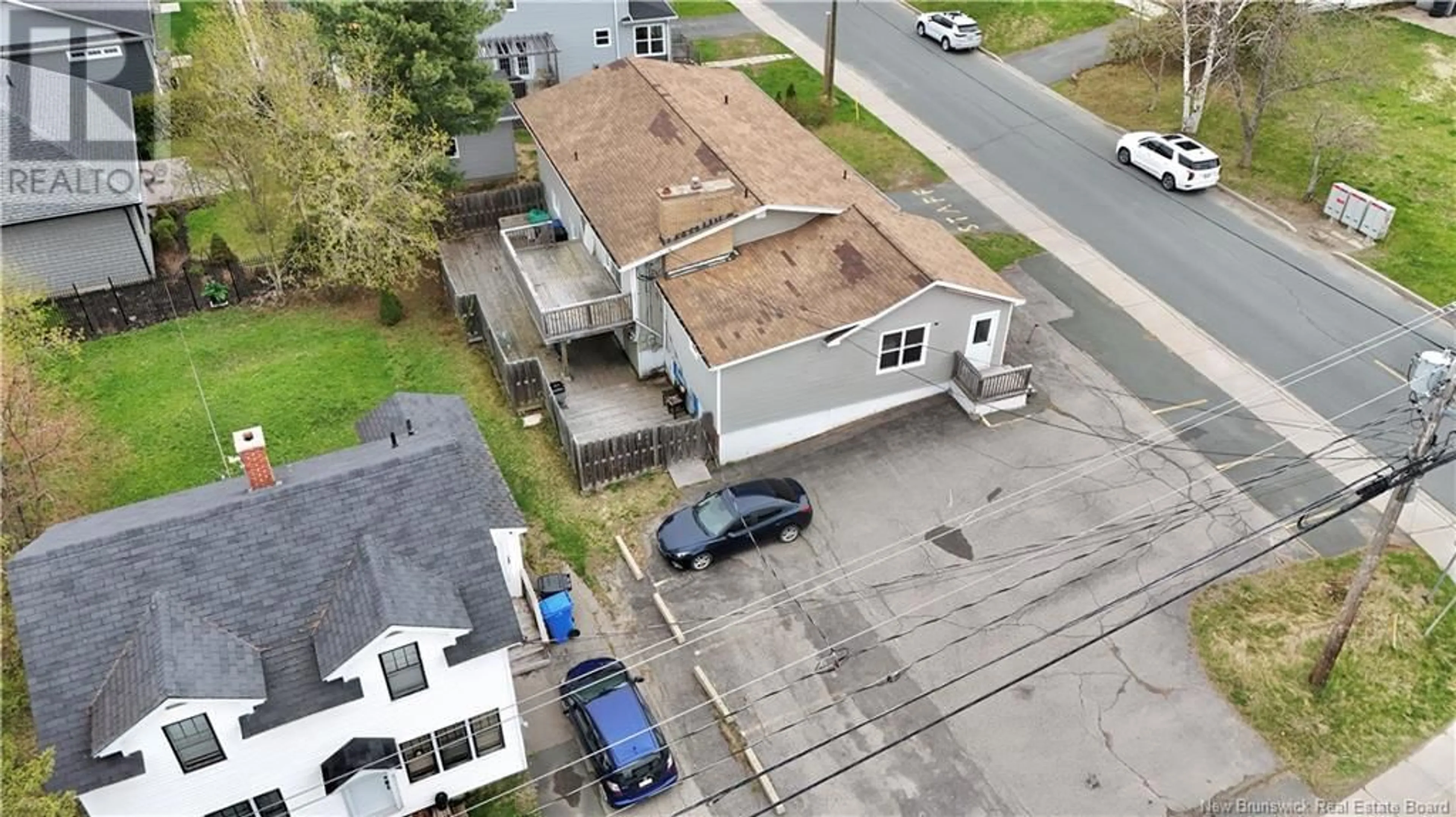 A pic from outside/outdoor area/front of a property/back of a property/a pic from drone, street for 205 YORK, Bathurst New Brunswick E2A1G9