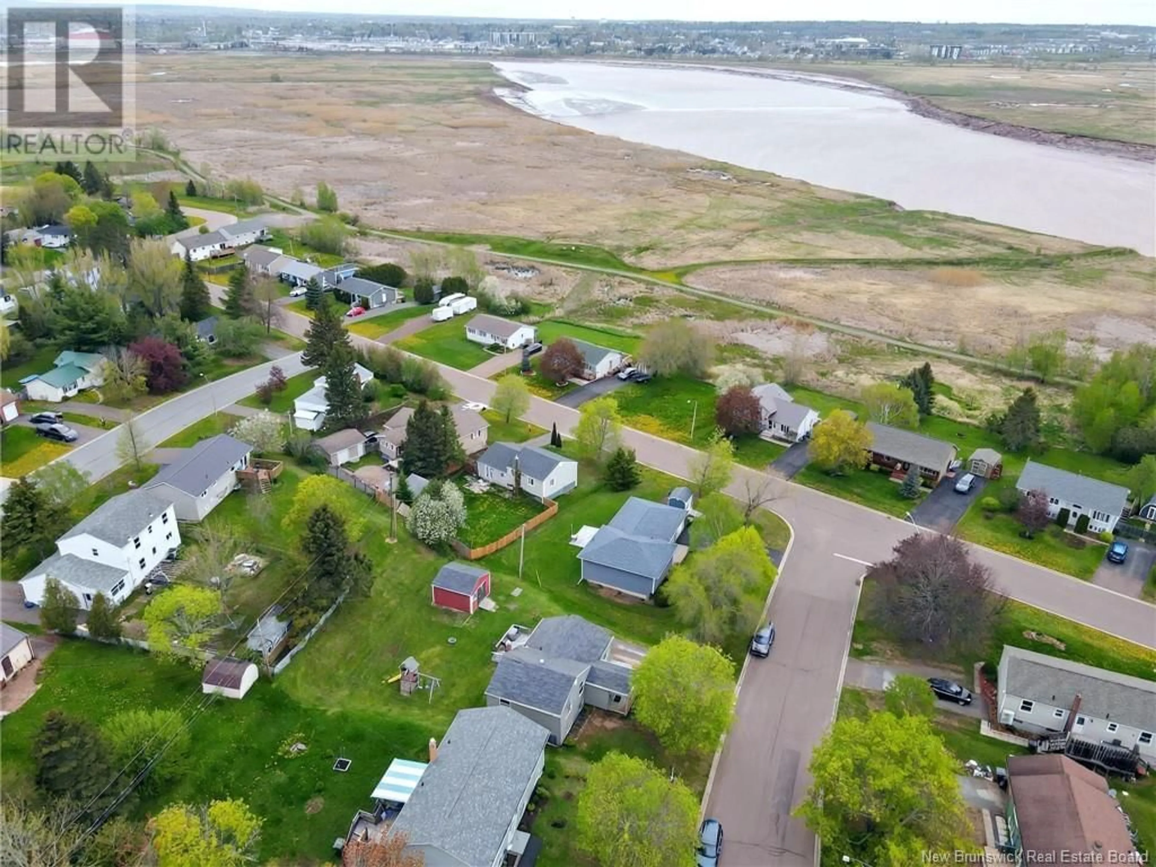 A pic from outside/outdoor area/front of a property/back of a property/a pic from drone, water/lake/river/ocean view for 38 RIVERLEA, Riverview New Brunswick E1B3N3
