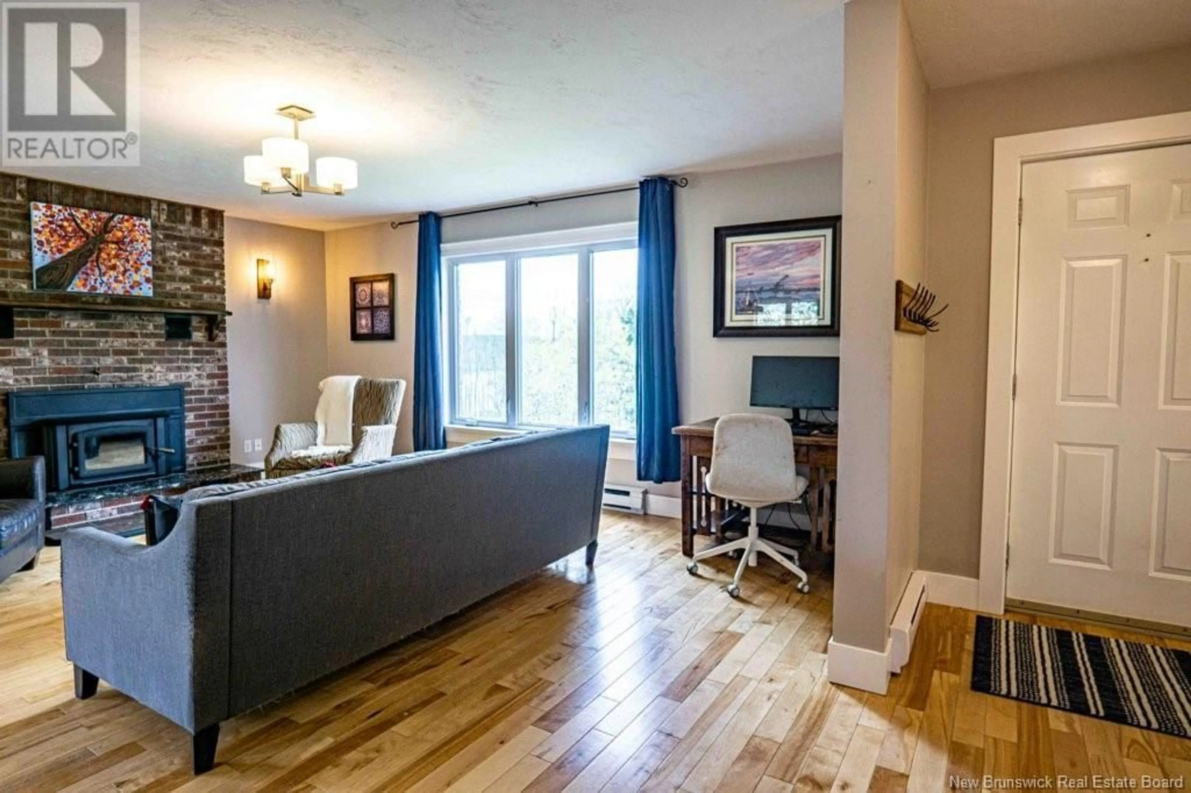 Living room with furniture, wood/laminate floor for 25 ROSEWOOD DRIVE, Fredericton New Brunswick E3C1L9