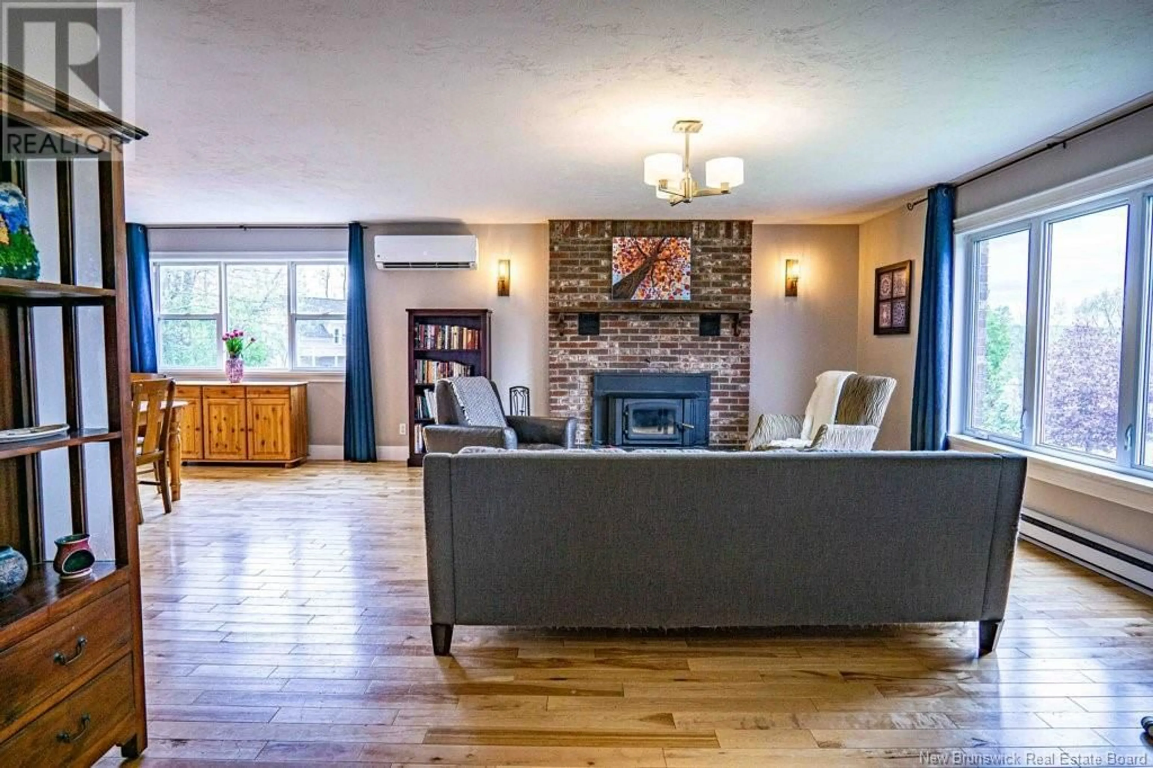 Living room with furniture, wood/laminate floor for 25 ROSEWOOD DRIVE, Fredericton New Brunswick E3C1L9