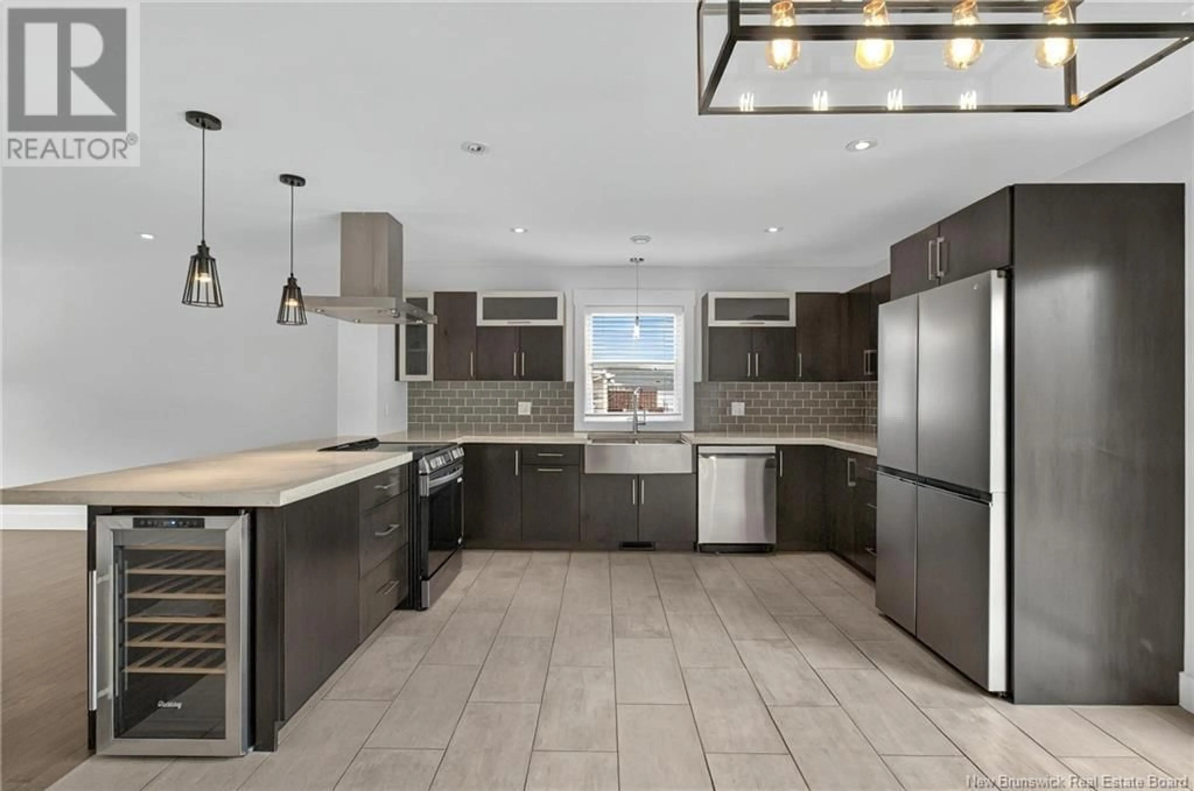 Open concept kitchen, ceramic/tile floor for 35 DORA COURT, Cap-Pelé New Brunswick E4N1C3