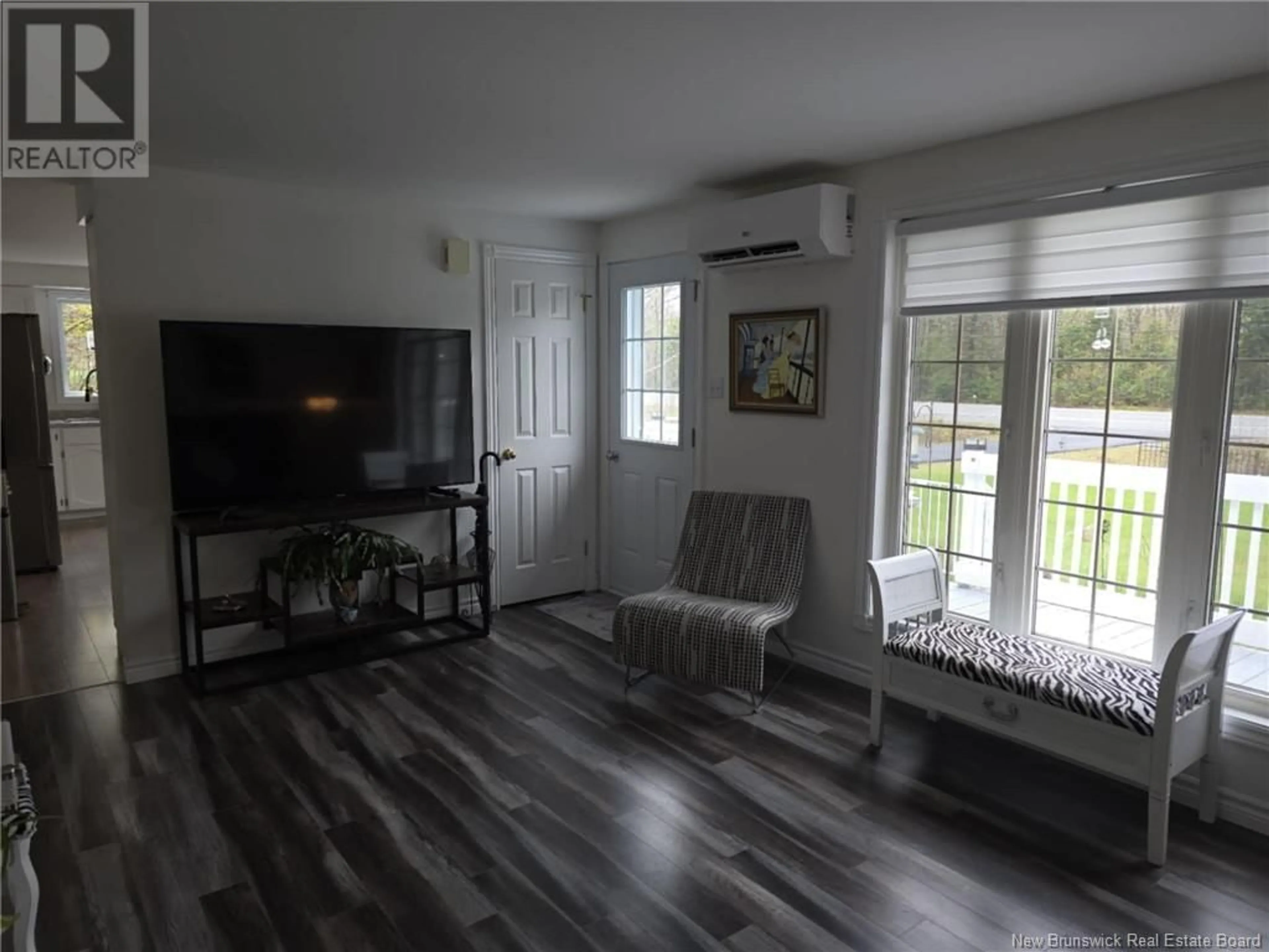 Living room with furniture, wood/laminate floor for 2751 RTE 11, Saint-Laurent New Brunswick E9G2J5