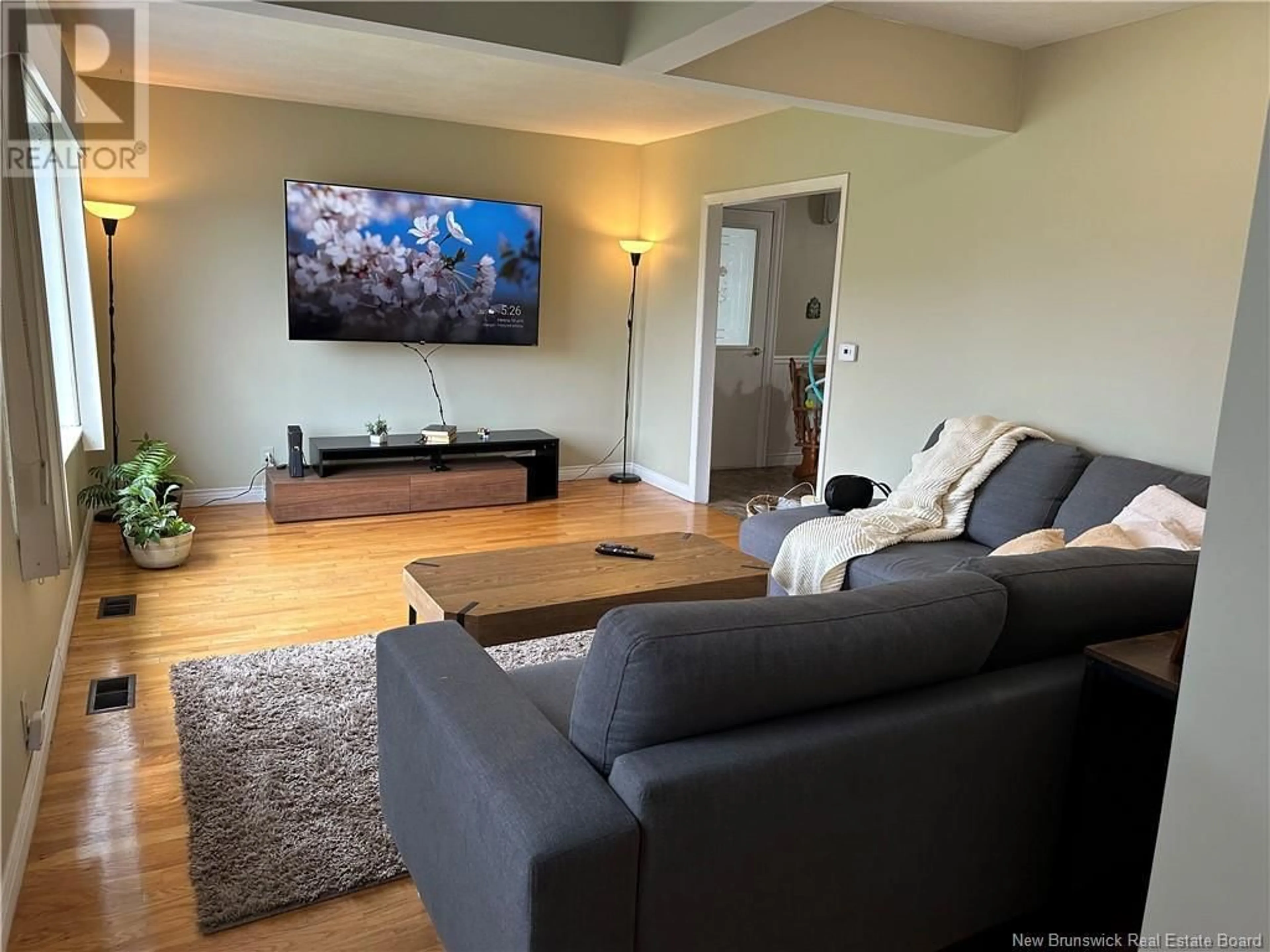Living room with furniture, wood/laminate floor for 5 EDOUARD AVENUE, Saint-Antoine New Brunswick E4V1G3