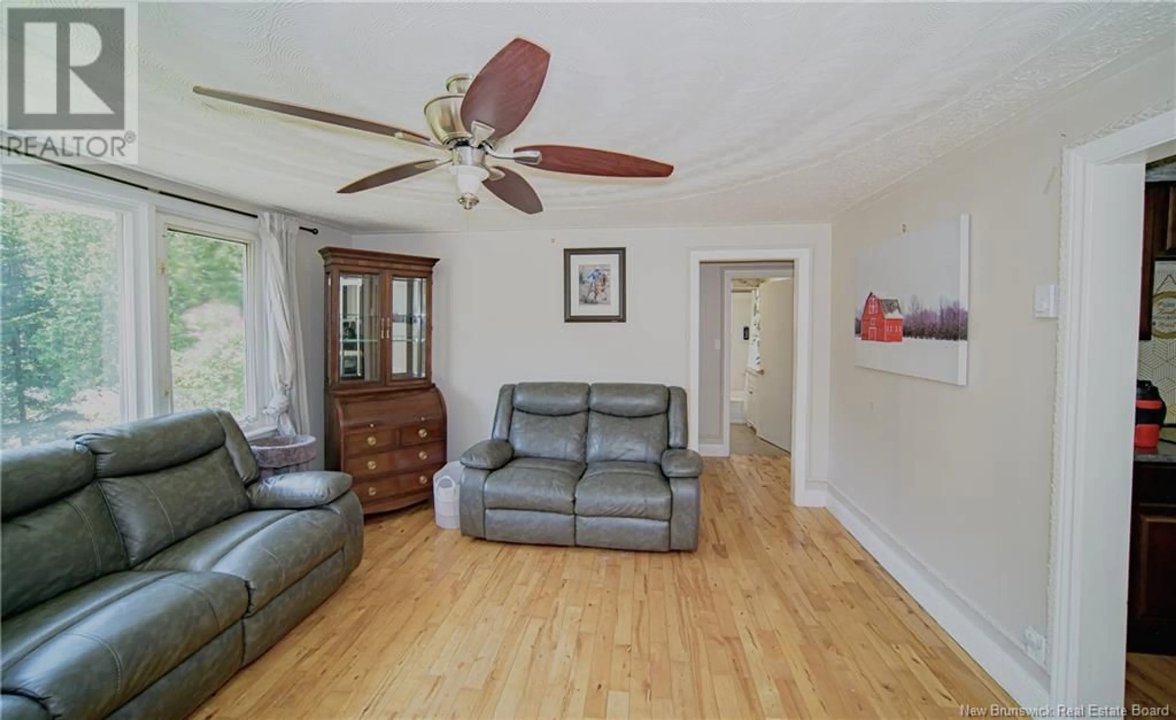 Living room with furniture, wood/laminate floor for 95 MCMINNIMAN COURT, Fredericton New Brunswick E3A8S5