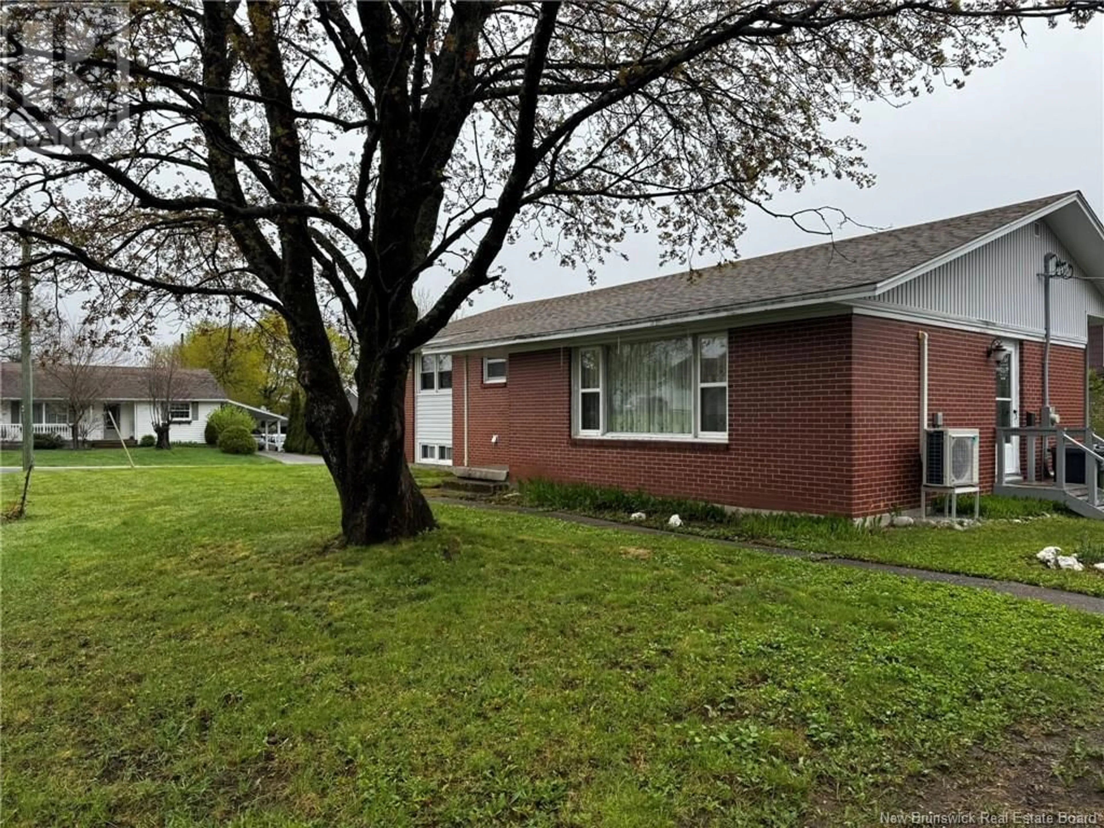 A pic from outside/outdoor area/front of a property/back of a property/a pic from drone, street for 310 MANDERSON DRIVE, Miramichi New Brunswick E1V1C4