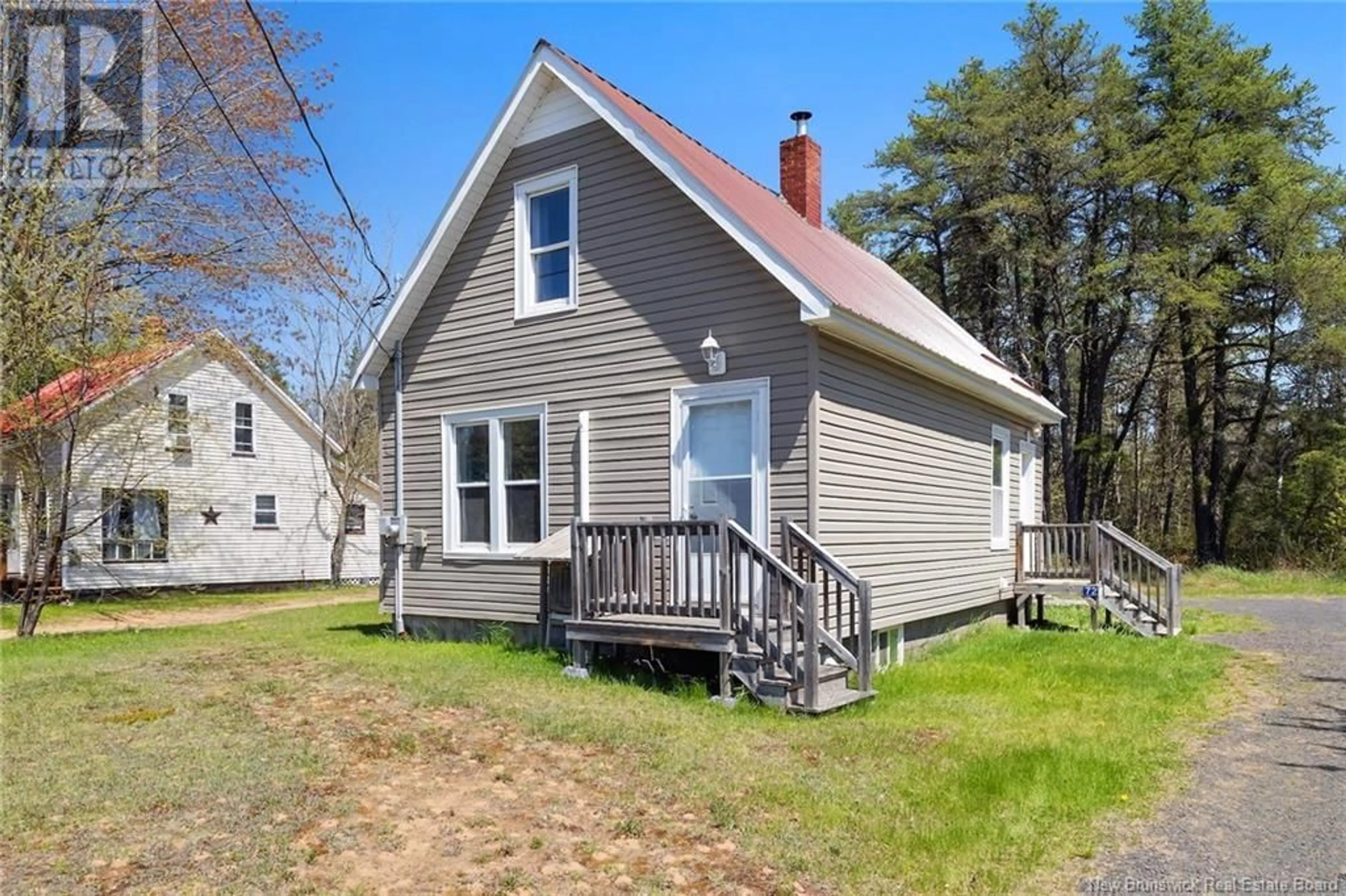 Home with vinyl exterior material, street for 72 MCLEOD AVENUE, Chipman New Brunswick E4A2B8
