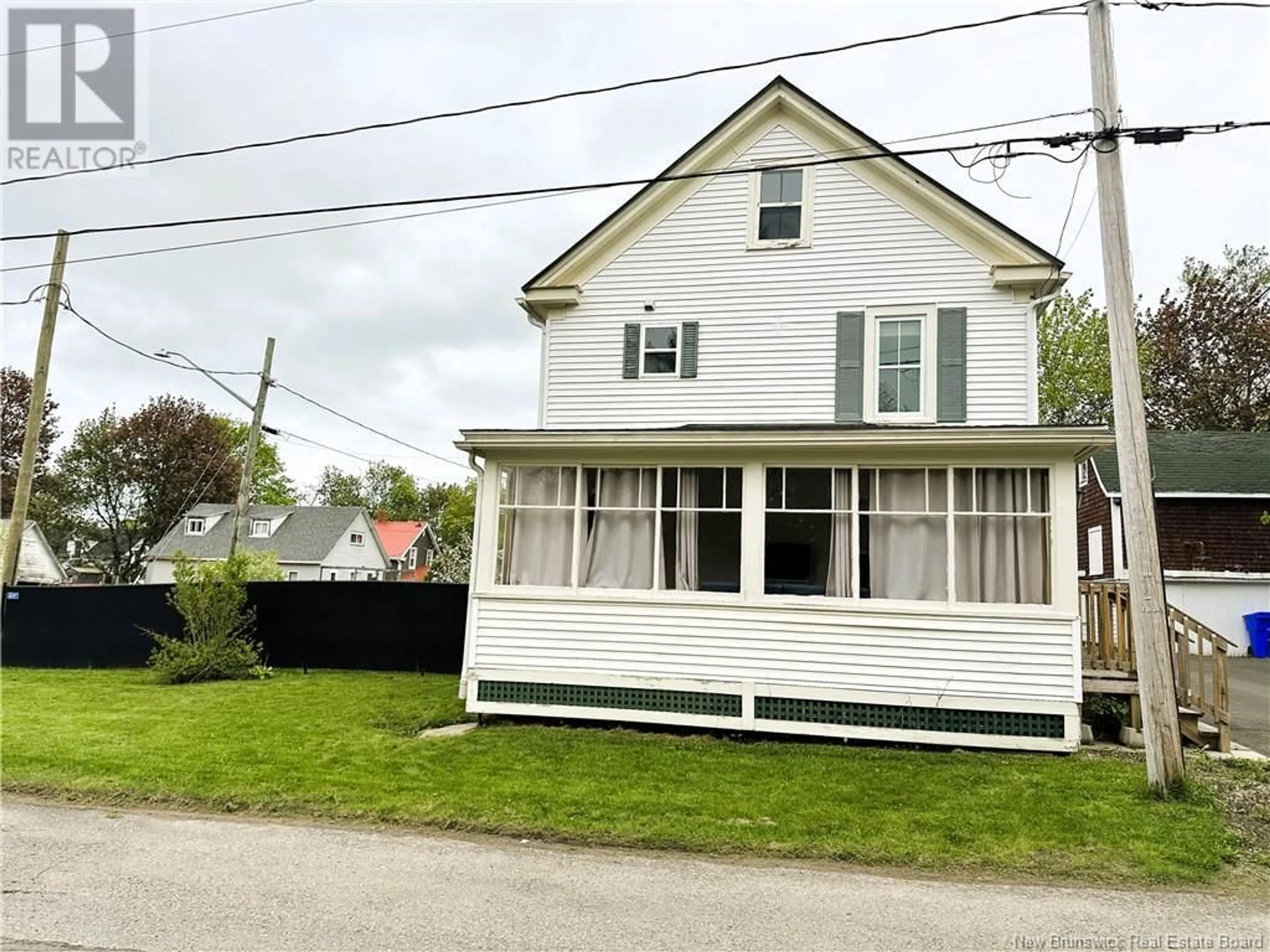 Home with vinyl exterior material, street for 21 ROSE STREET, St. Stephen New Brunswick E3L2P6