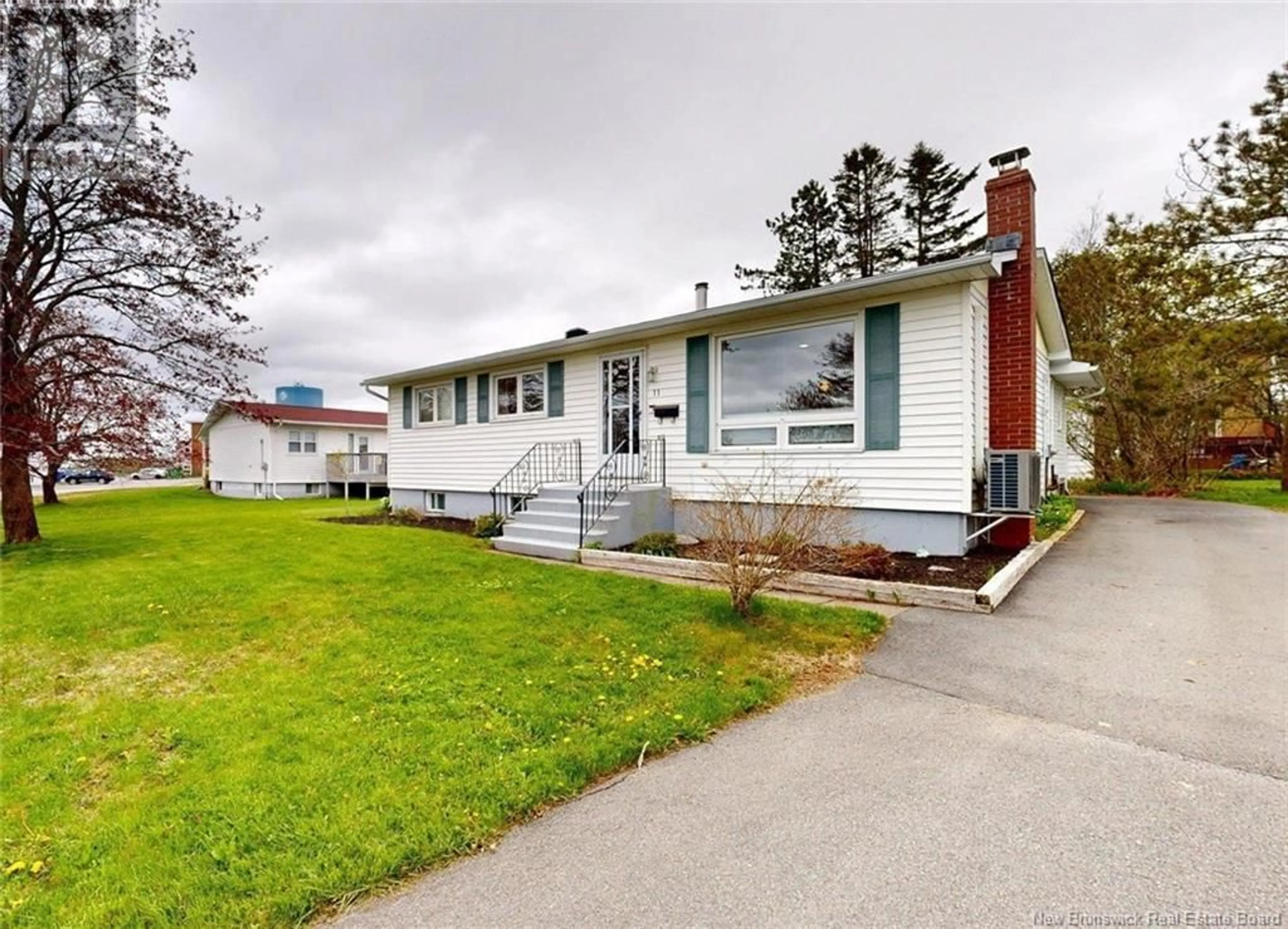 Home with vinyl exterior material, street for 11 LOYALIST LANE, Saint John New Brunswick E2M4B3