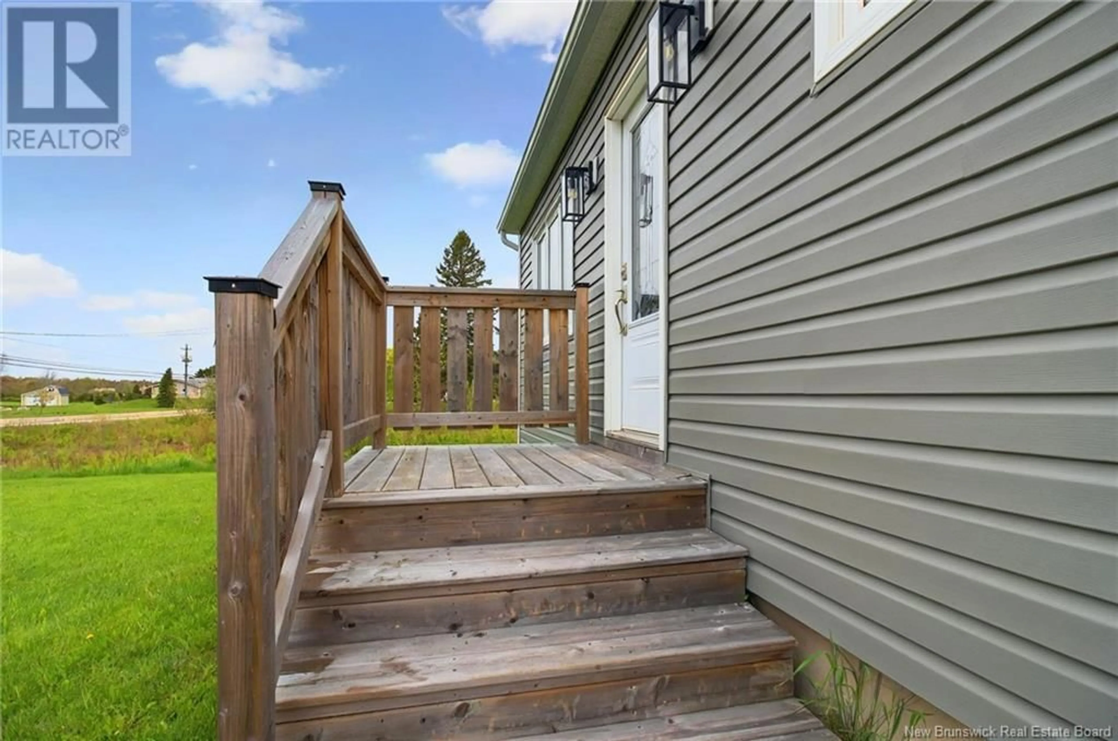 Home with vinyl exterior material, street for 128 TROIS-RUISSEAUX ROAD, Cap-Pelé New Brunswick E4N2B8