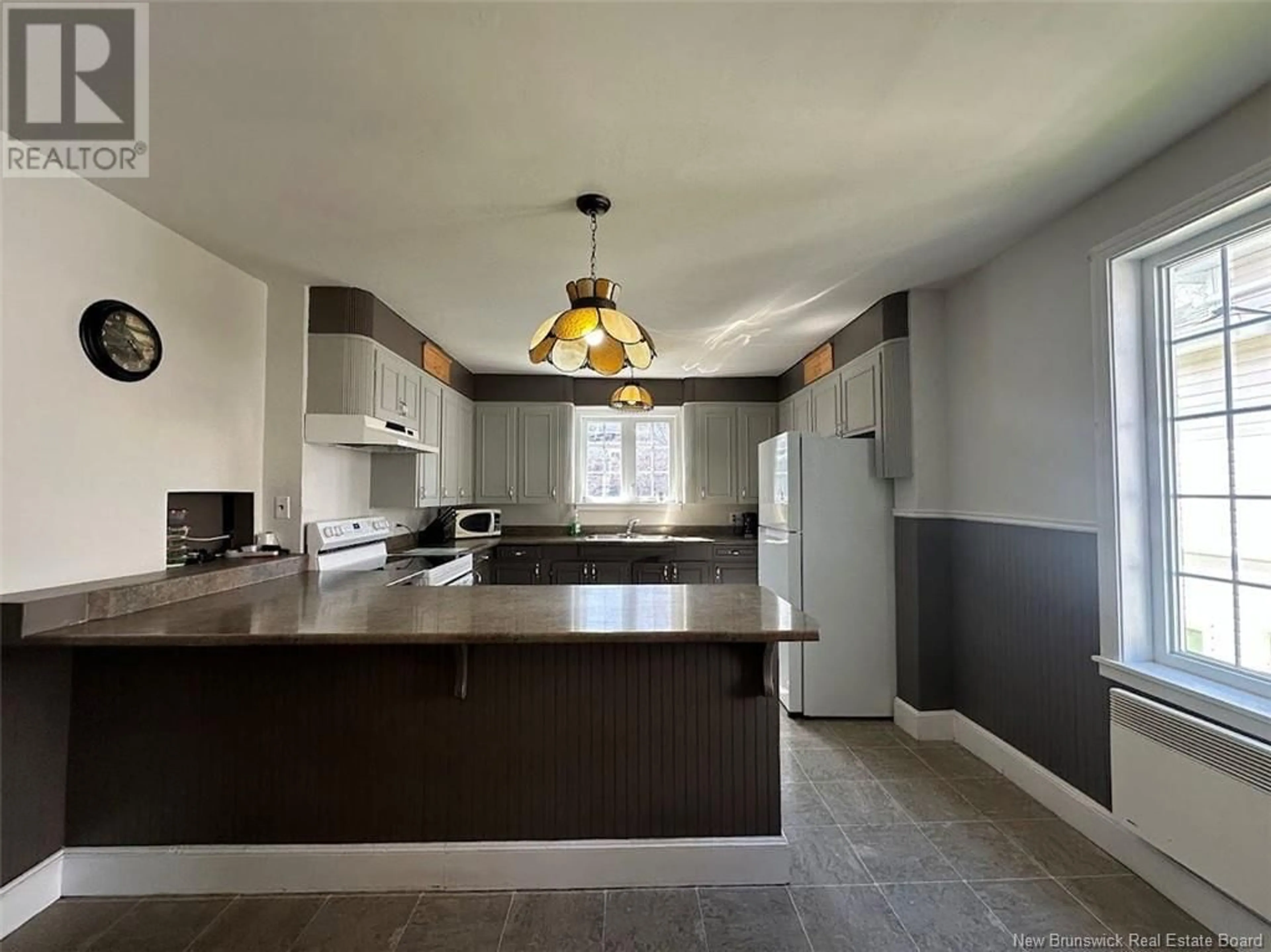 Open concept kitchen, ceramic/tile floor for 30 FRASER AVENUE, Edmundston New Brunswick E3V2B1
