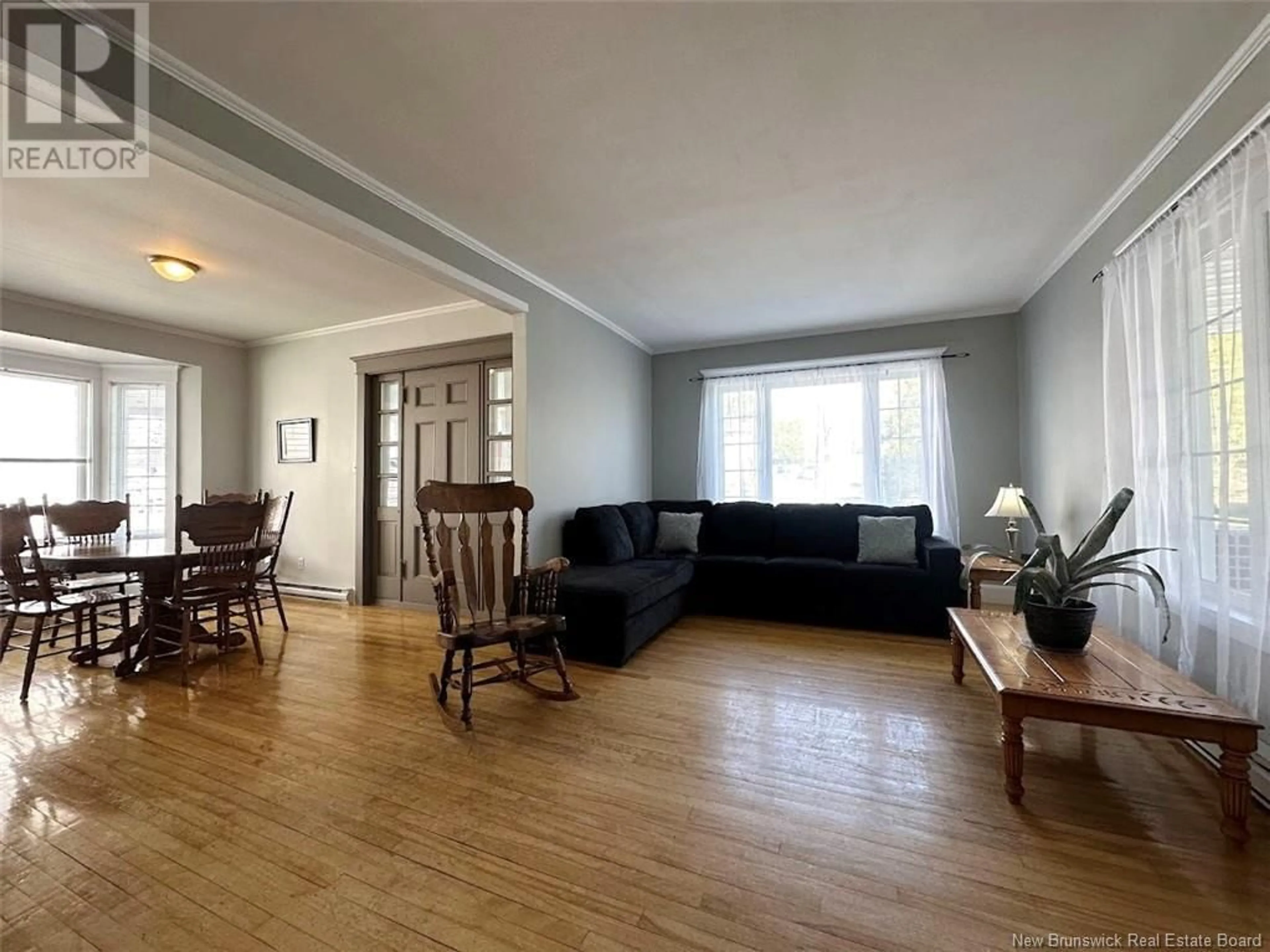 Living room with furniture, wood/laminate floor for 30 FRASER AVENUE, Edmundston New Brunswick E3V2B1