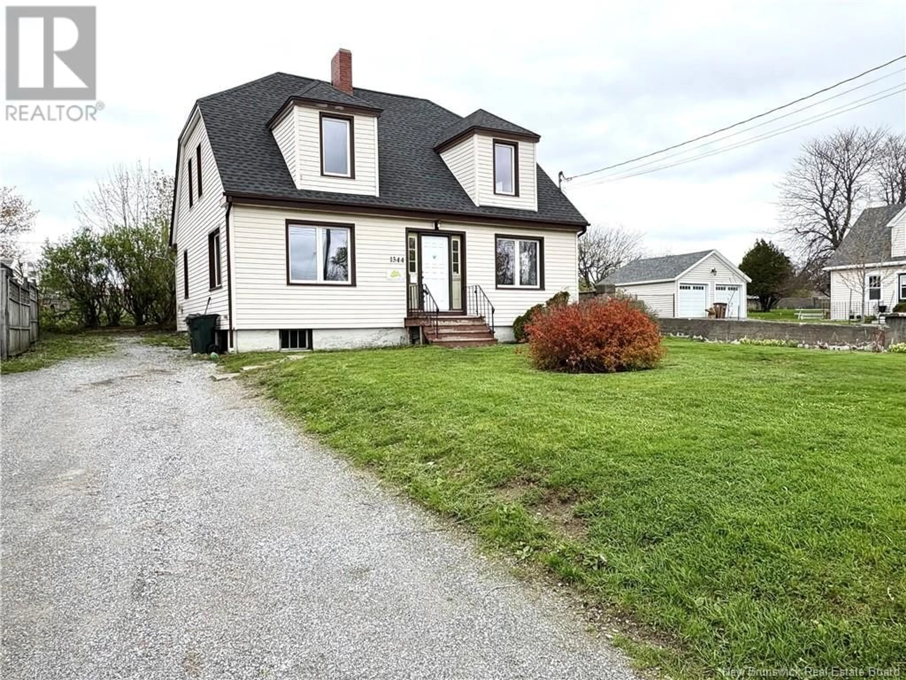 Home with vinyl exterior material, street for 1344 MANAWAGONISH ROAD, Saint John New Brunswick E2M3Y1