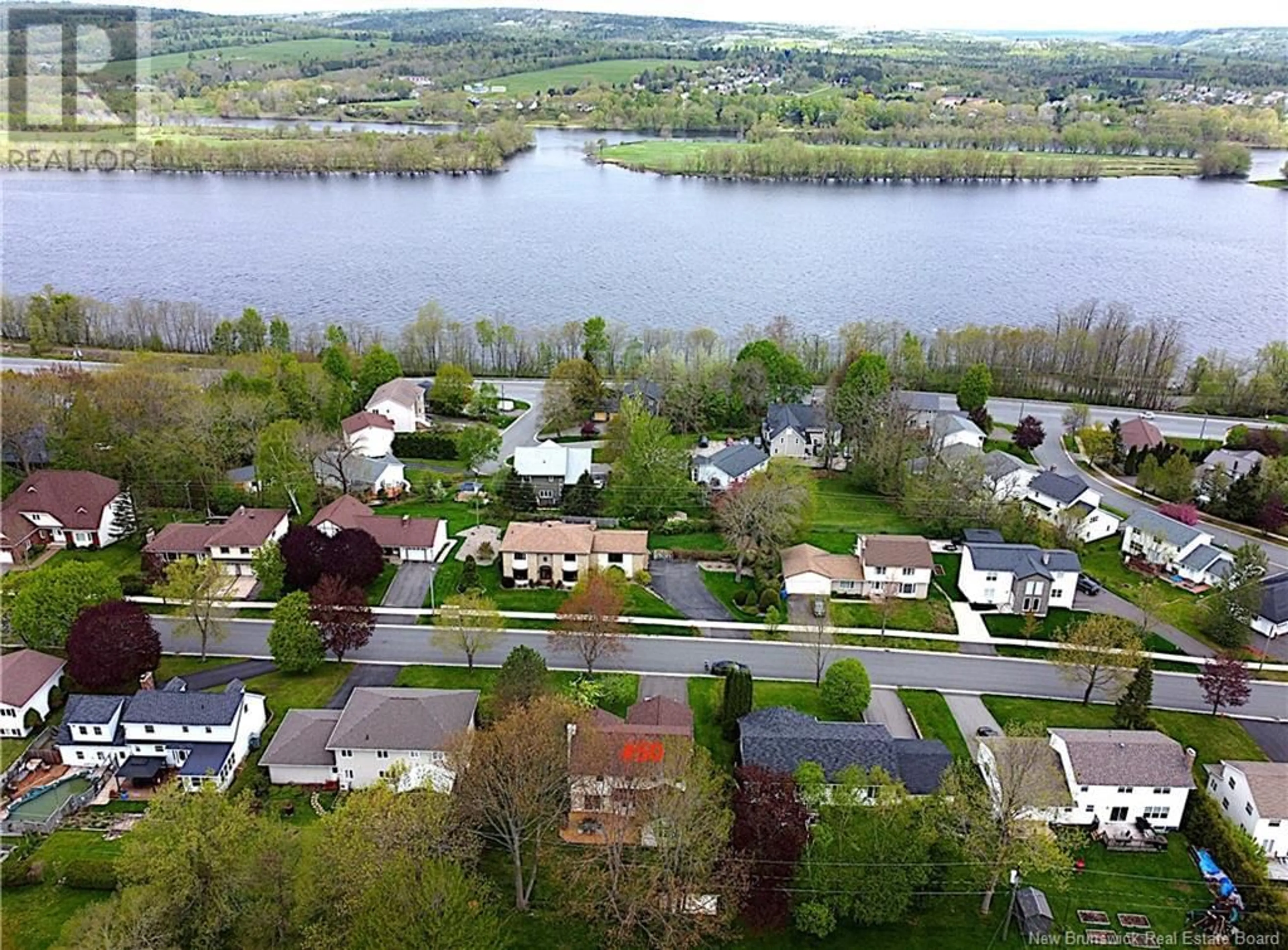 A pic from outside/outdoor area/front of a property/back of a property/a pic from drone, water/lake/river/ocean view for 50 TALISMAN CRESCENT, Fredericton New Brunswick E3C1L9