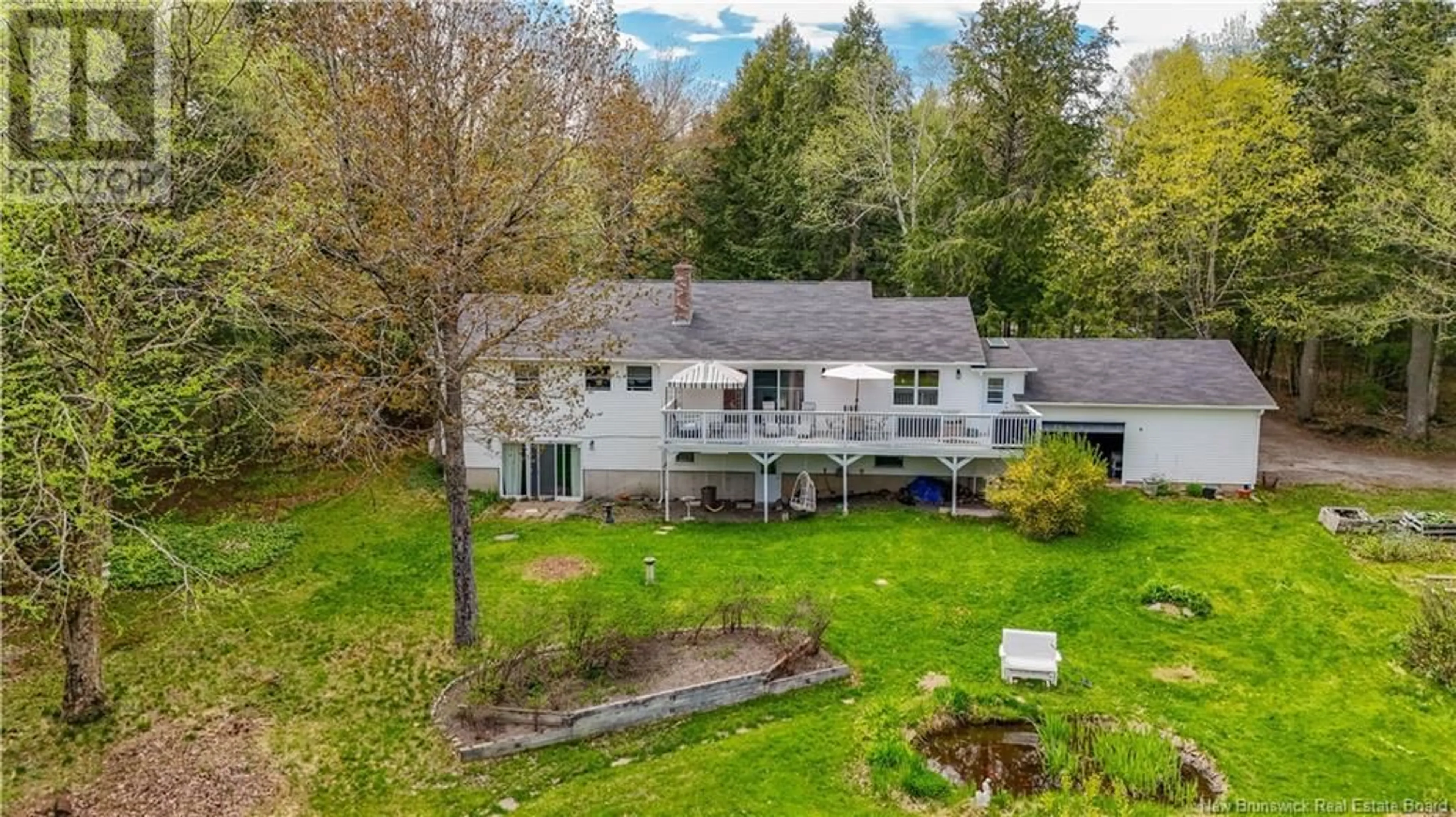 A pic from outside/outdoor area/front of a property/back of a property/a pic from drone, unknown for 600 DEERWOOD DRIVE, Hanwell New Brunswick E3E1C5