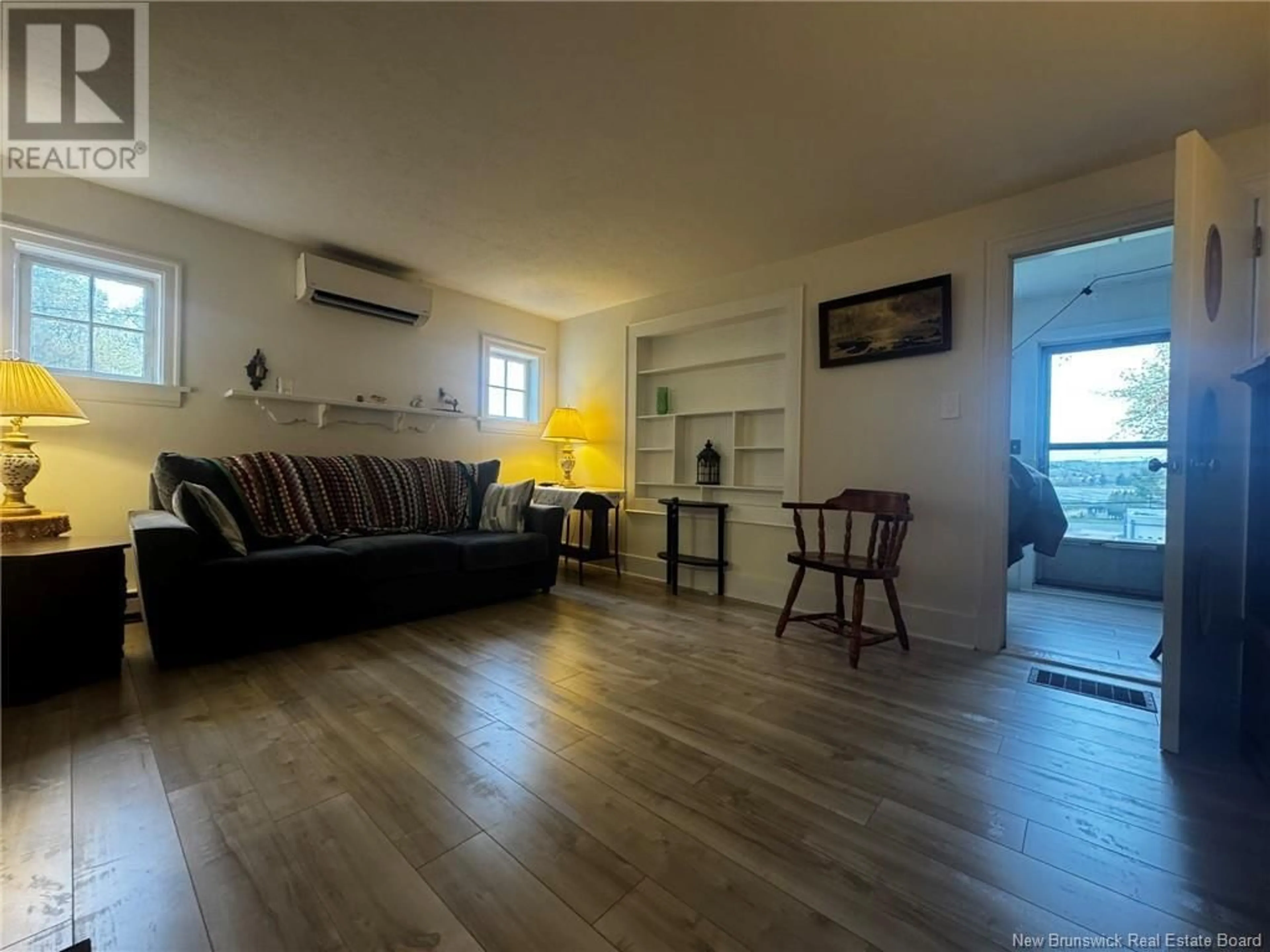 Living room with furniture, wood/laminate floor for 232 DUKE STREET, Miramichi New Brunswick E1N1J3