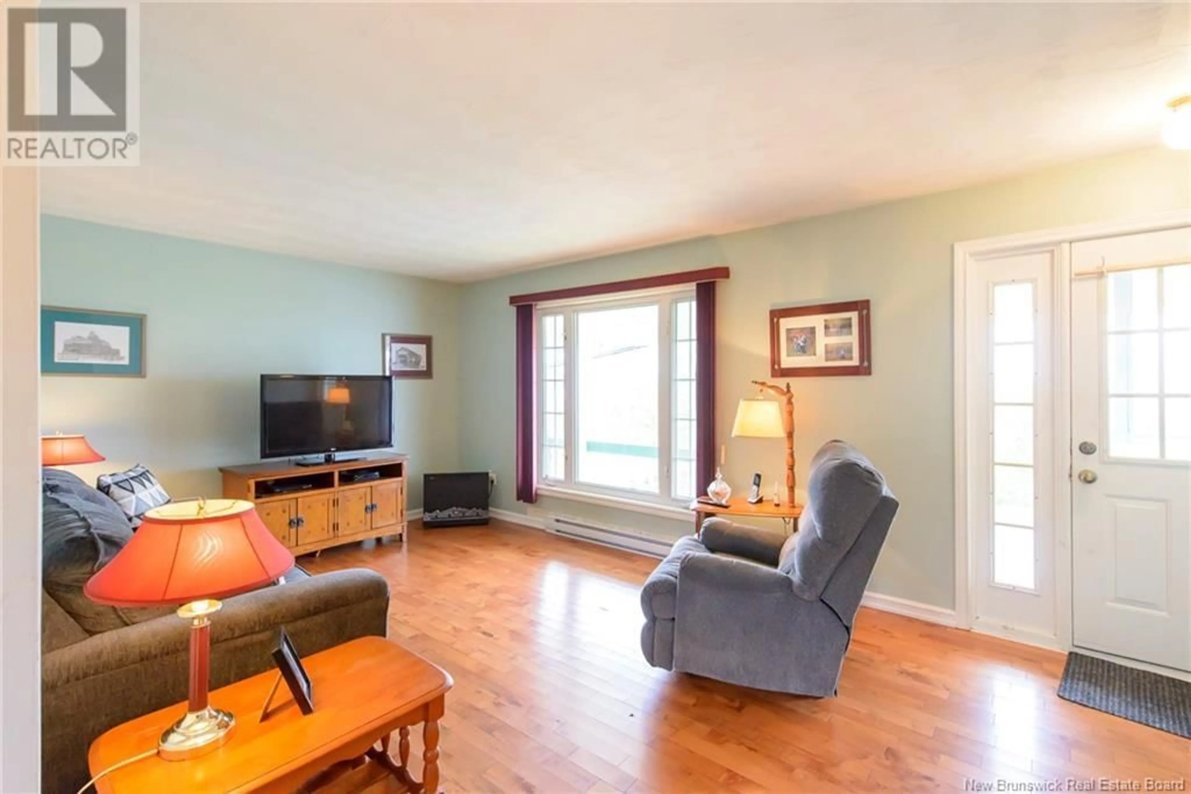 Living room with furniture, wood/laminate floor for 63 CITY LINE, Saint John New Brunswick E2M1K9