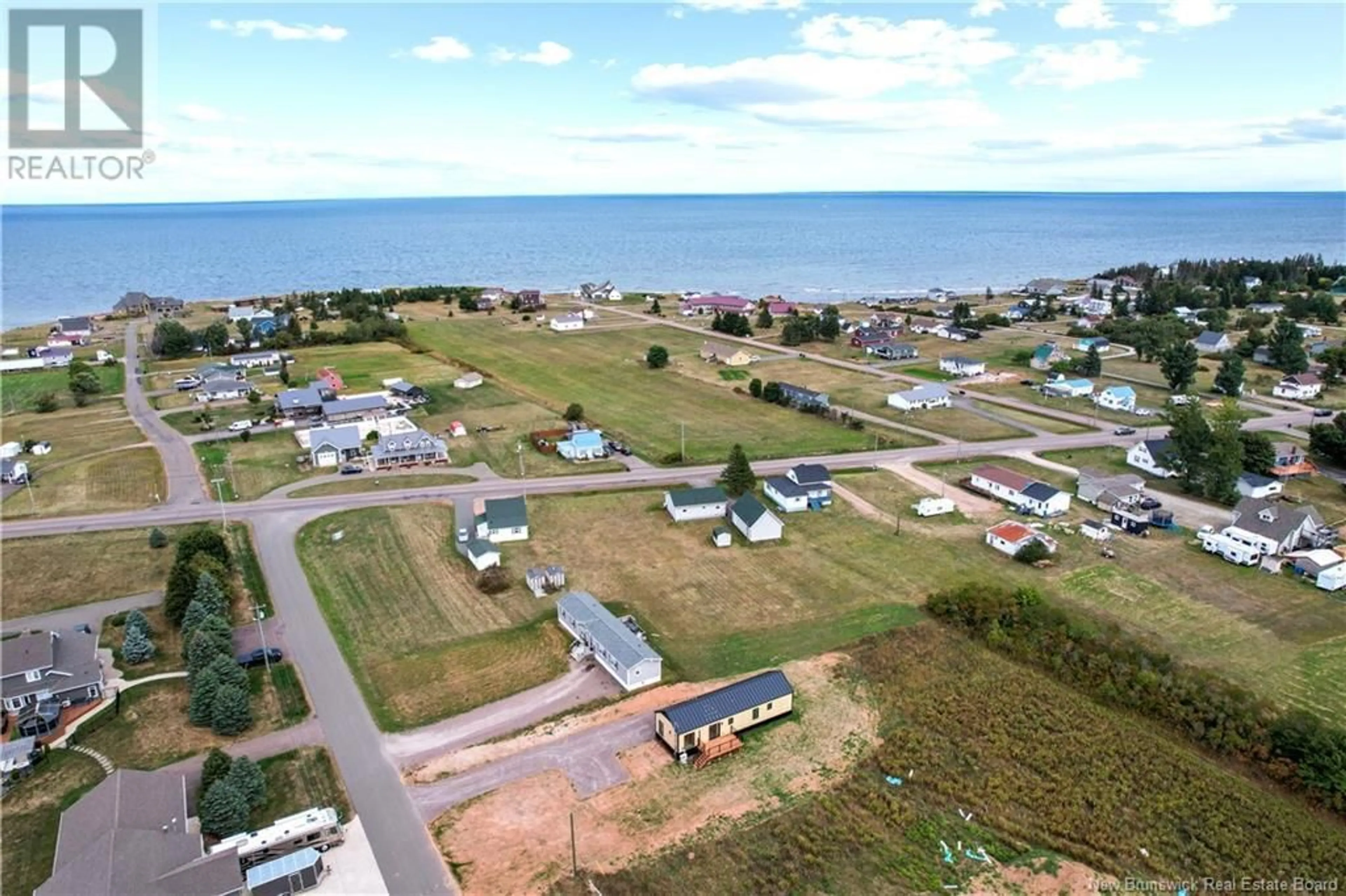 A pic from outside/outdoor area/front of a property/back of a property/a pic from drone, water/lake/river/ocean view for 14 BEDECHE STREET, Cap-Pelé New Brunswick E4N0G1