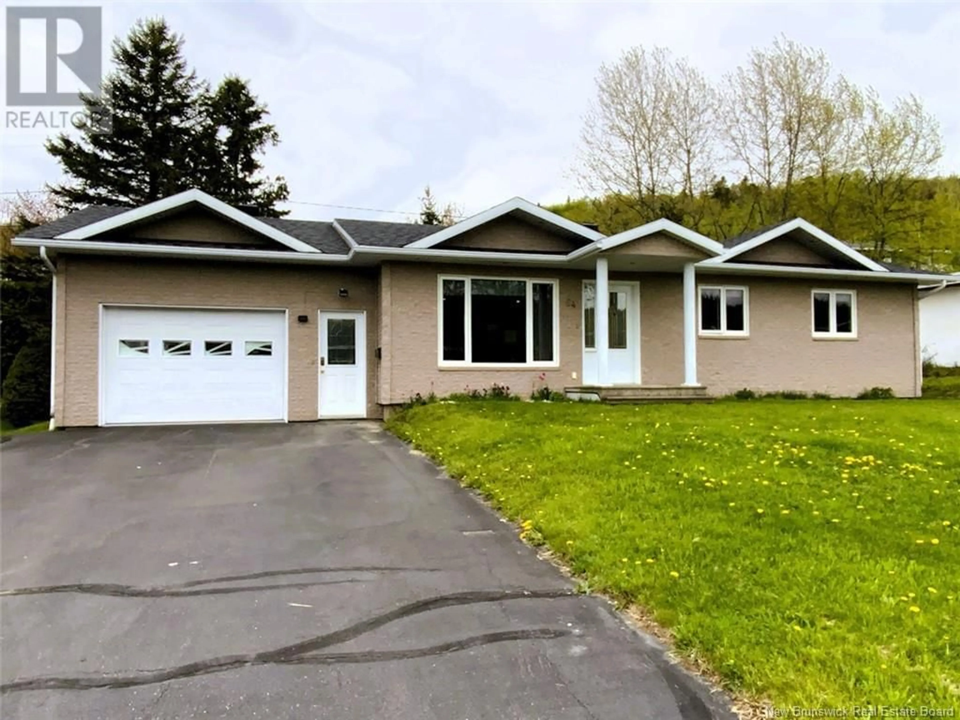 Home with vinyl exterior material, street for 64 CHOUINARD AVENUE, Edmundston New Brunswick E3V3L8