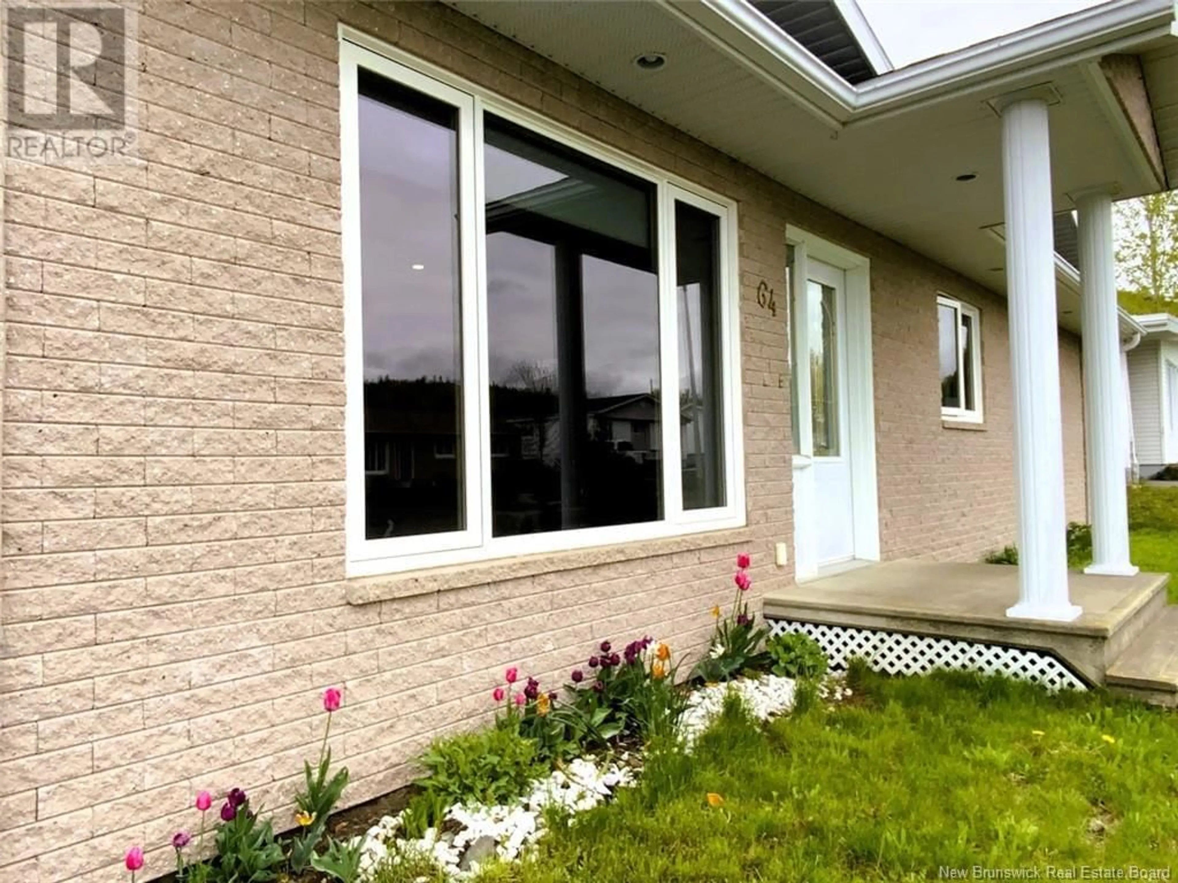 Home with vinyl exterior material, street for 64 CHOUINARD AVENUE, Edmundston New Brunswick E3V3L8