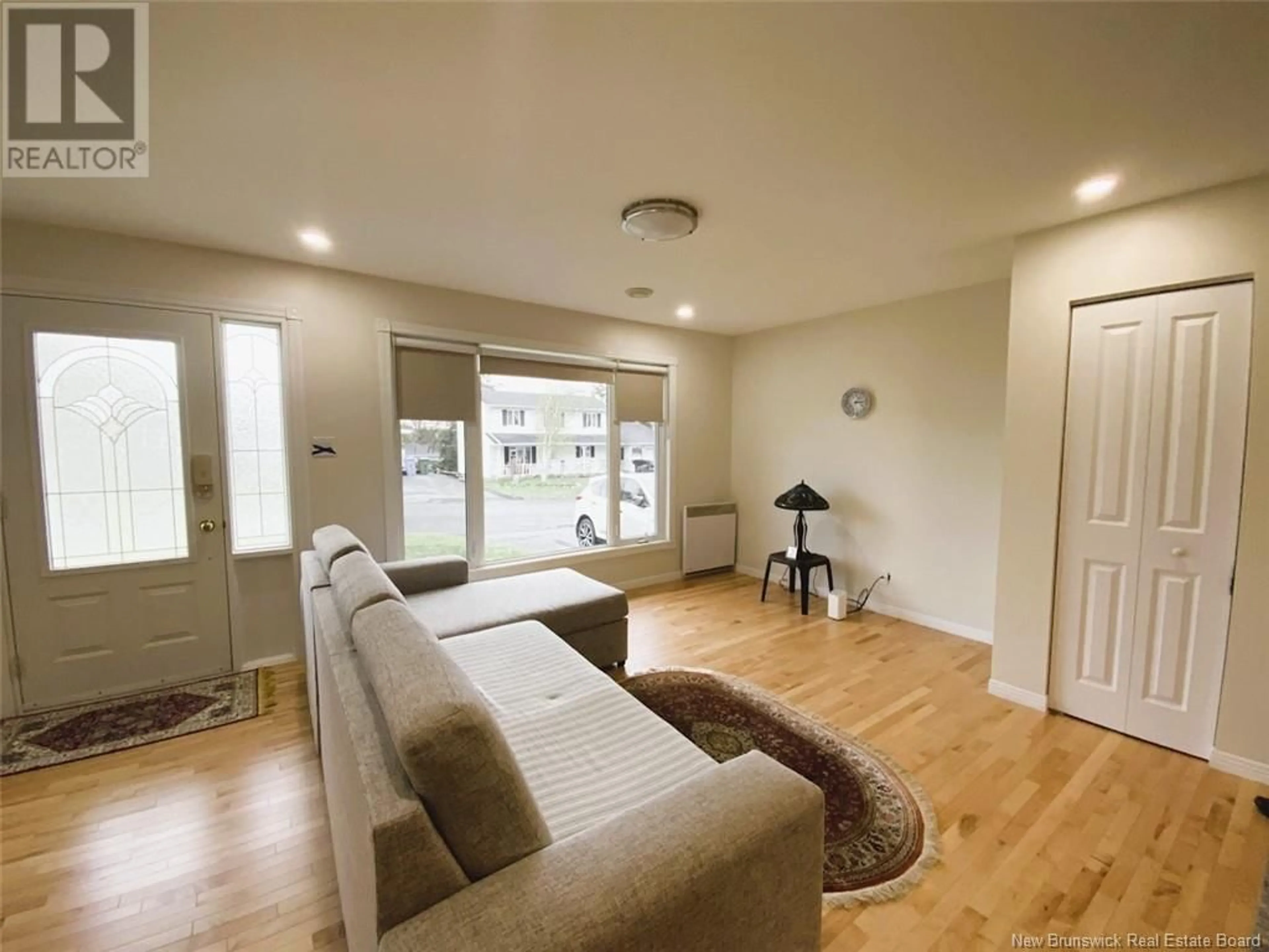 Living room with furniture, unknown for 64 CHOUINARD AVENUE, Edmundston New Brunswick E3V3L8