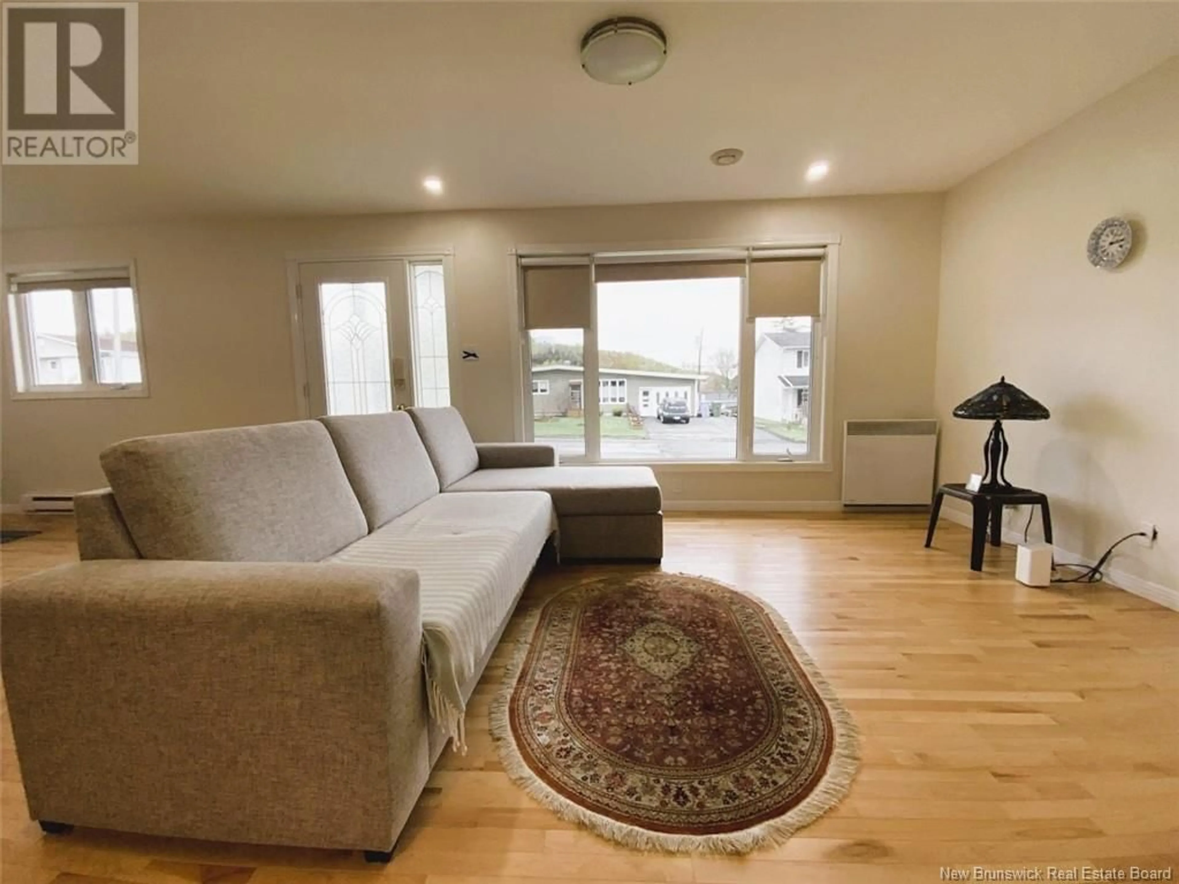 Living room with furniture, unknown for 64 CHOUINARD AVENUE, Edmundston New Brunswick E3V3L8
