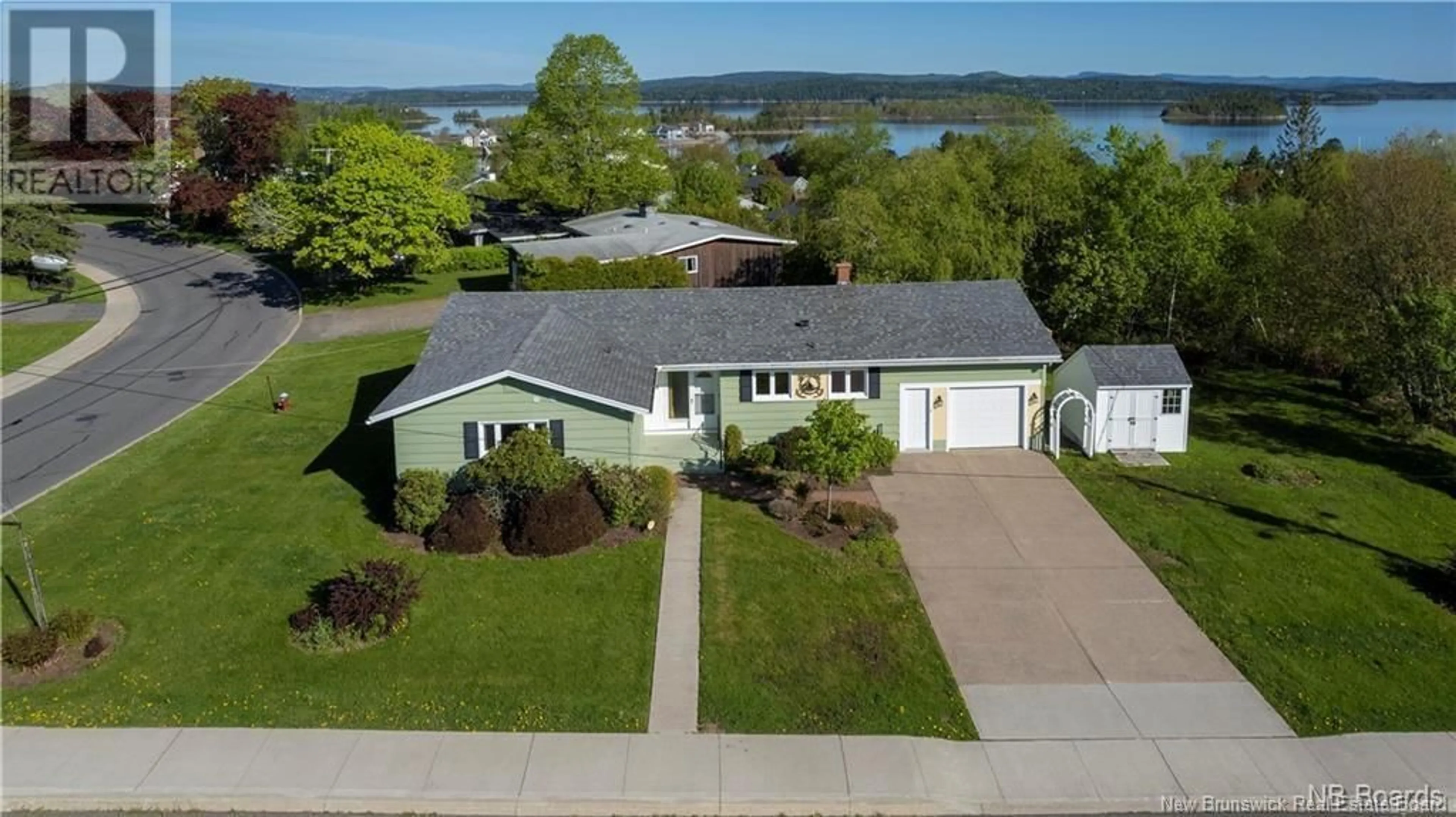 A pic from outside/outdoor area/front of a property/back of a property/a pic from drone, water/lake/river/ocean view for 36 SCHOFIELD COURT, Saint John New Brunswick E2K2B3