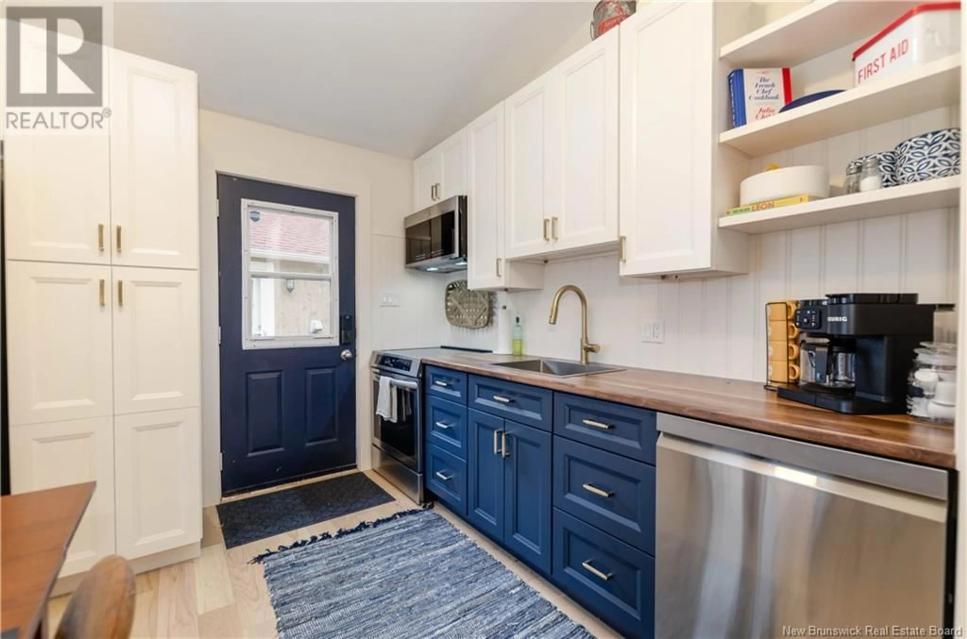Open concept kitchen, ceramic/tile floor for 15 - 23 ACADIE STREET, Bouctouche New Brunswick E4S2T6