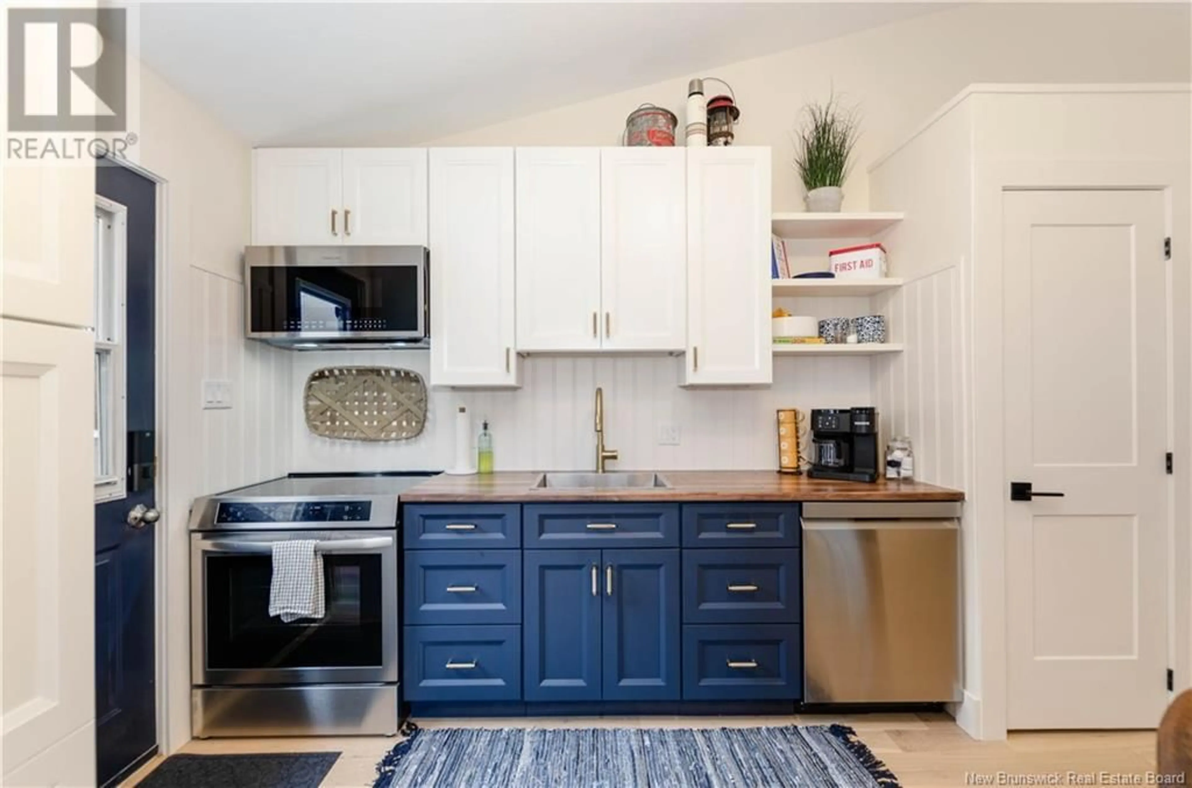 Open concept kitchen, wood/laminate floor for 15 - 23 ACADIE STREET, Bouctouche New Brunswick E4S2T6