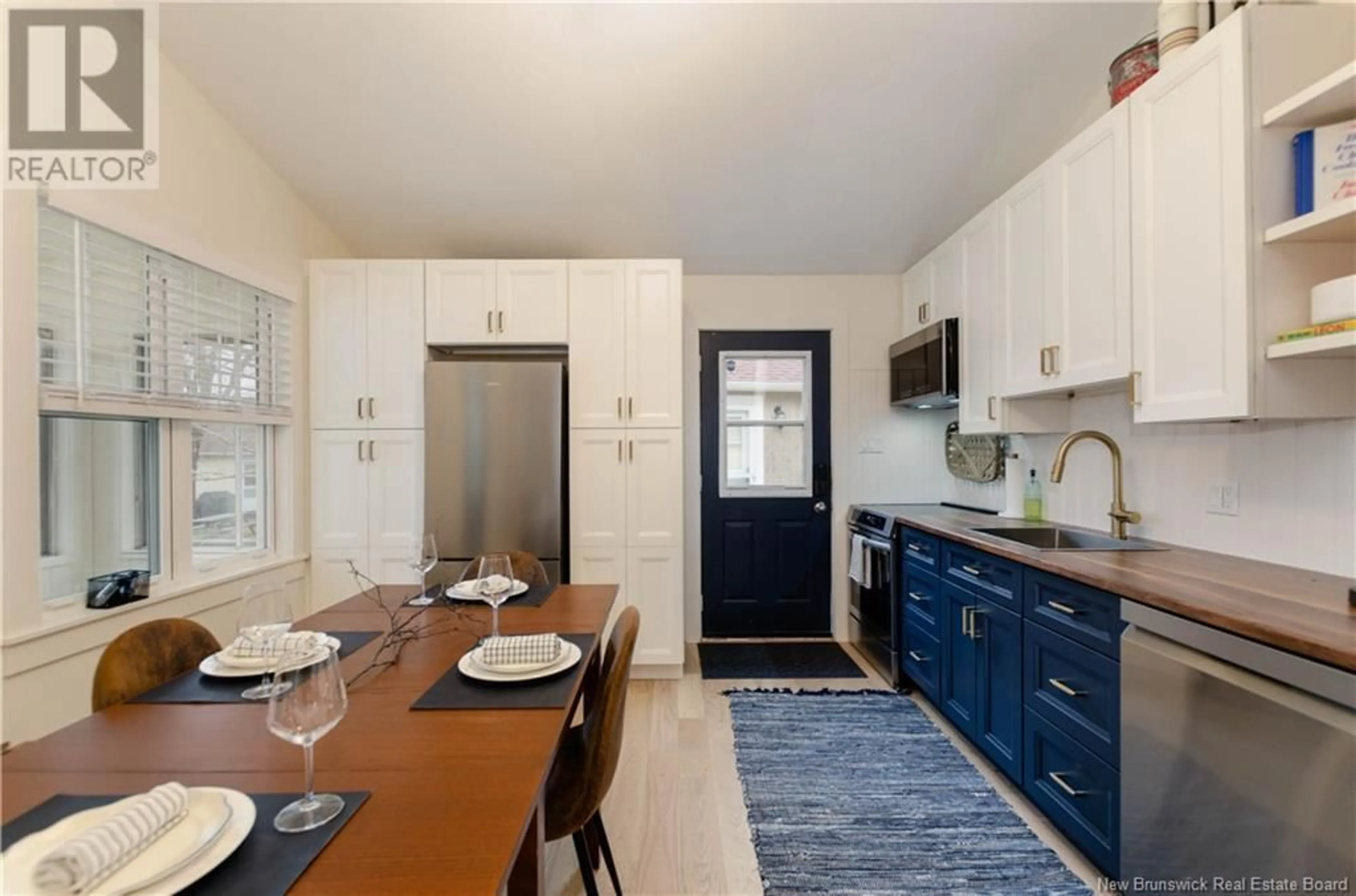 Open concept kitchen, ceramic/tile floor for 15 - 23 ACADIE STREET, Bouctouche New Brunswick E4S2T6