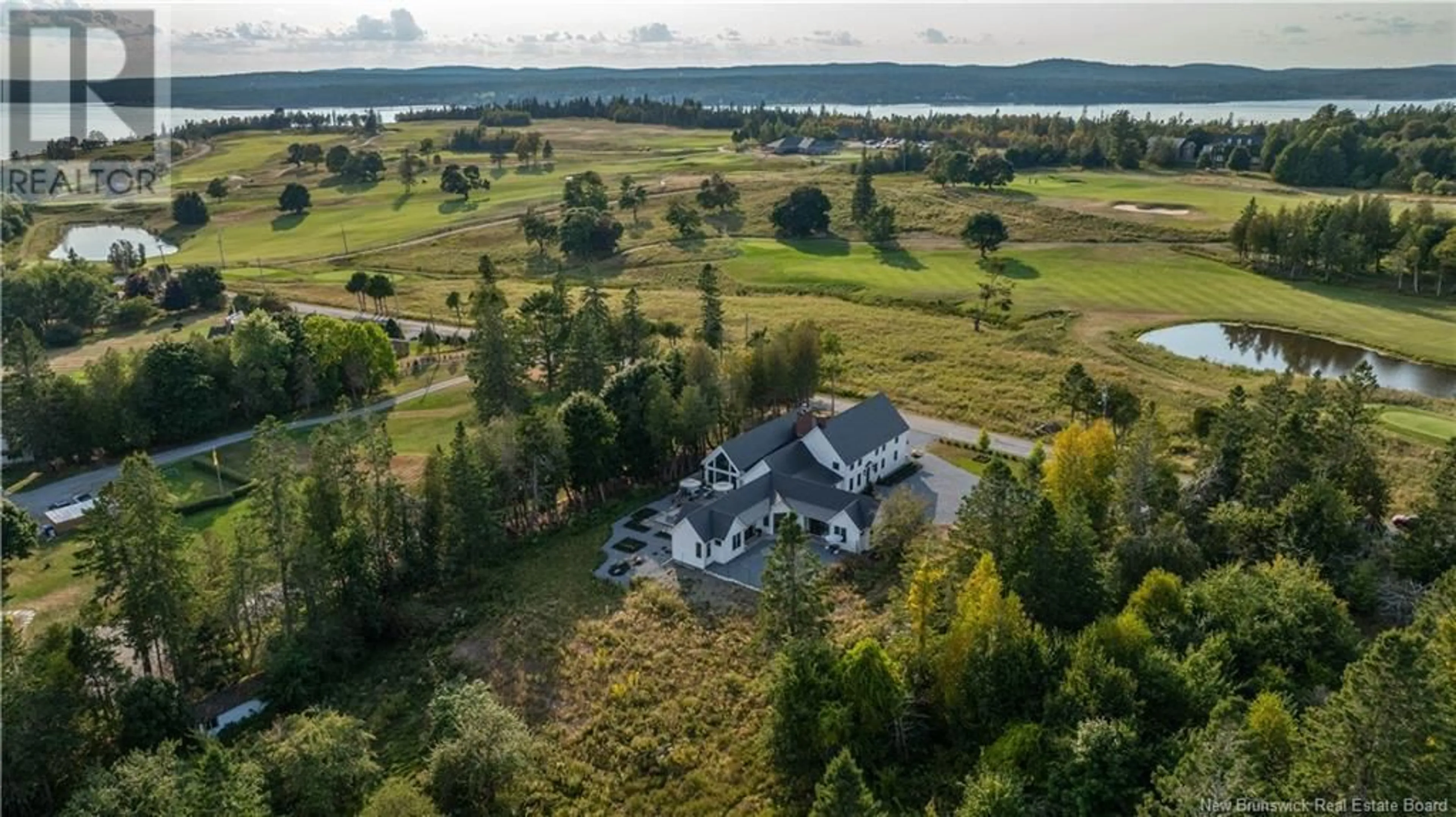 A pic from outside/outdoor area/front of a property/back of a property/a pic from drone, water/lake/river/ocean view for 91 CEDAR LANE, Saint Andrews New Brunswick E5B2L4
