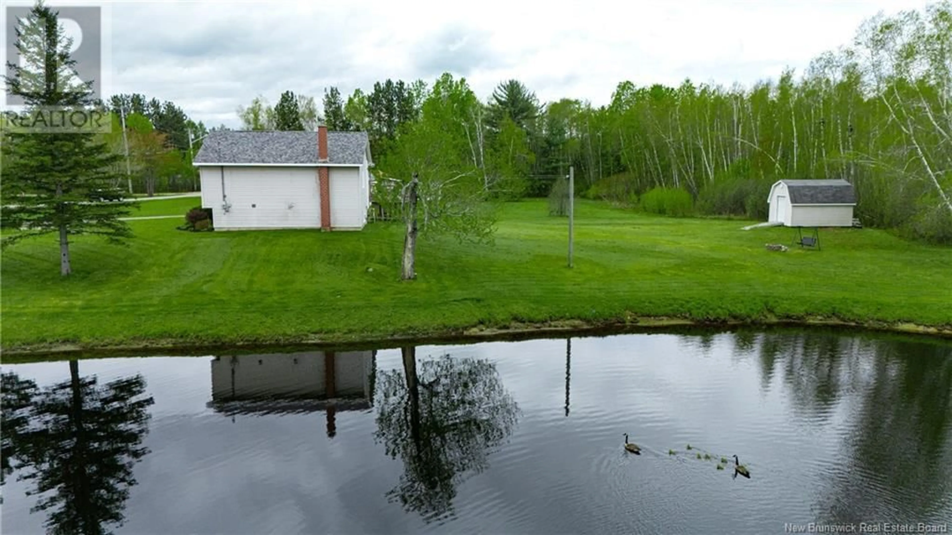 A pic from outside/outdoor area/front of a property/back of a property/a pic from drone, water/lake/river/ocean view for 71 PORTOBELLO DRIVE, Maugerville New Brunswick E3A8M4