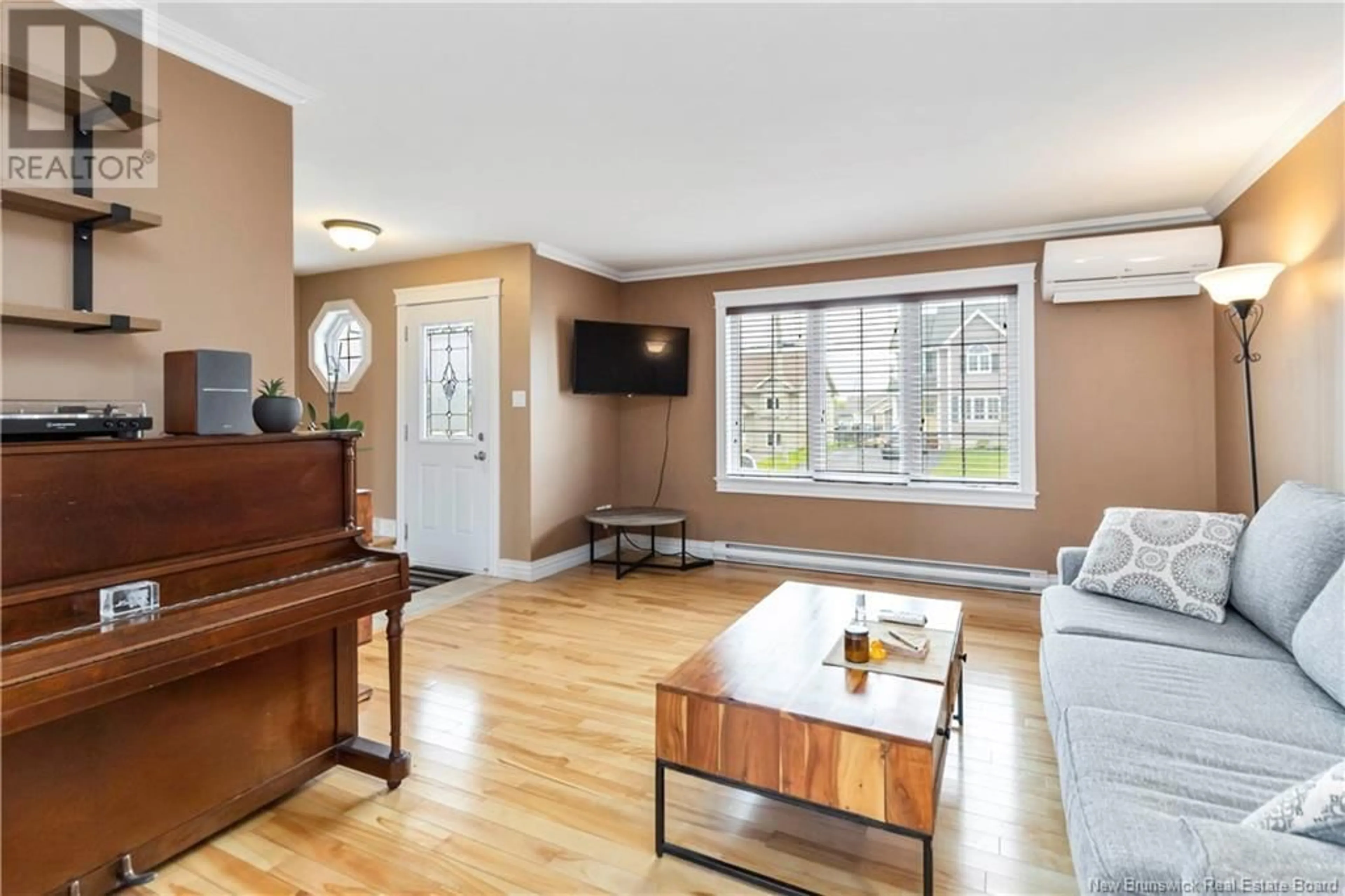 Living room with furniture, wood/laminate floor for 17 COACHMEN STREET, Riverview New Brunswick E1B3T7