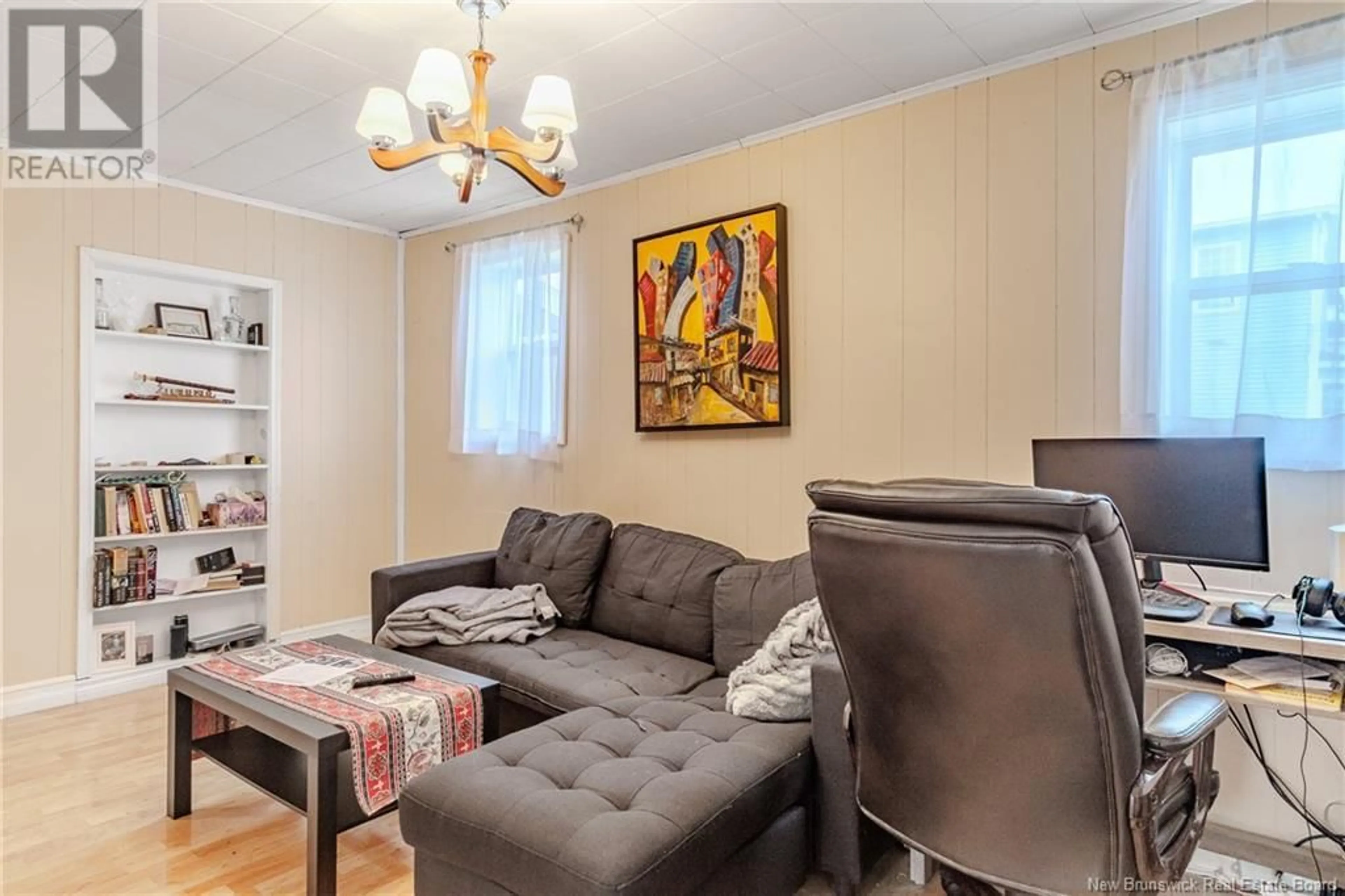Living room with furniture, wood/laminate floor for 181 SUNBURY DRIVE, Fredericton Junction New Brunswick E5L1R5