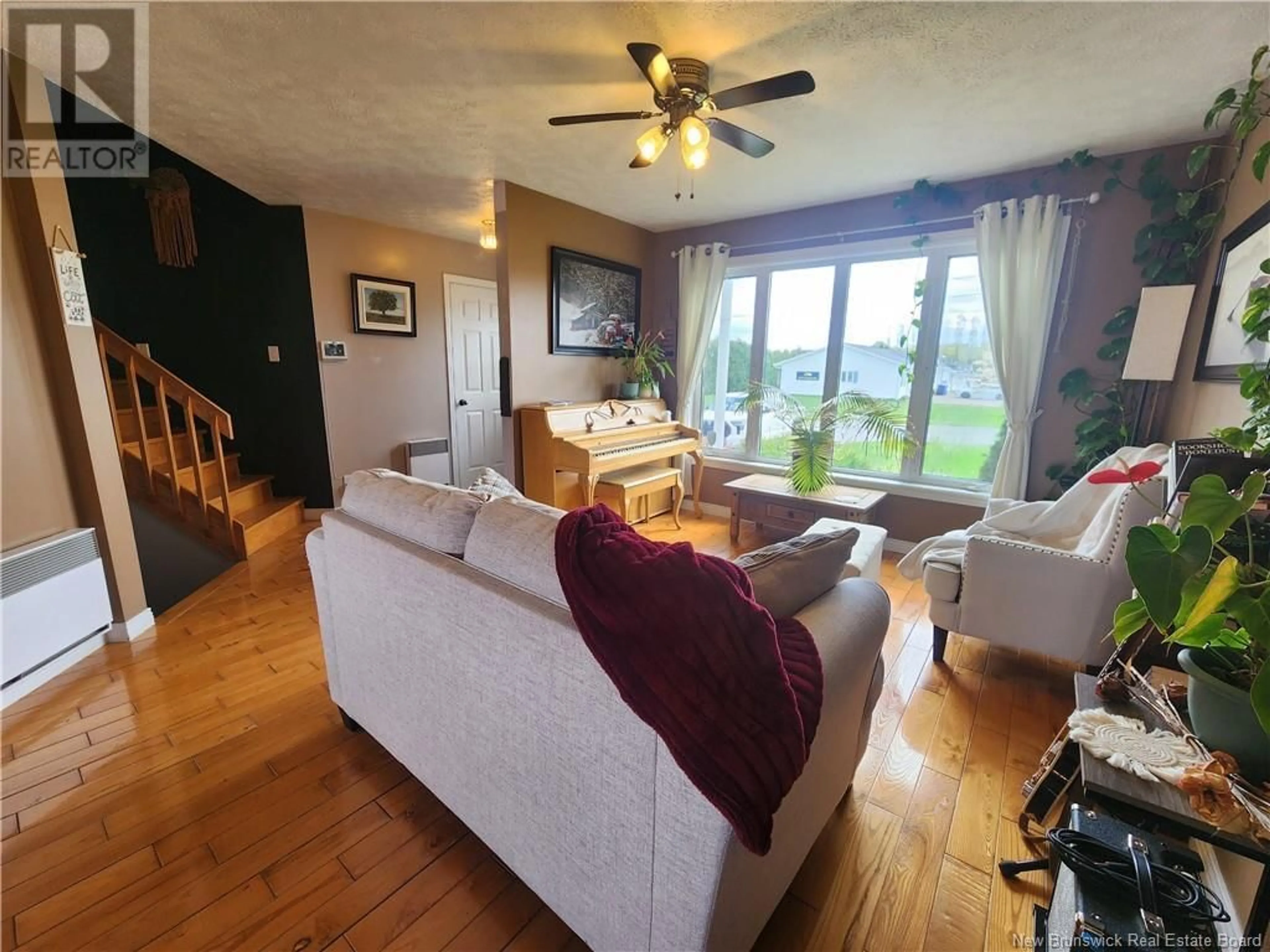 Living room with furniture, wood/laminate floor for 111 MORIN STREET, Drummond New Brunswick E3Y2E2