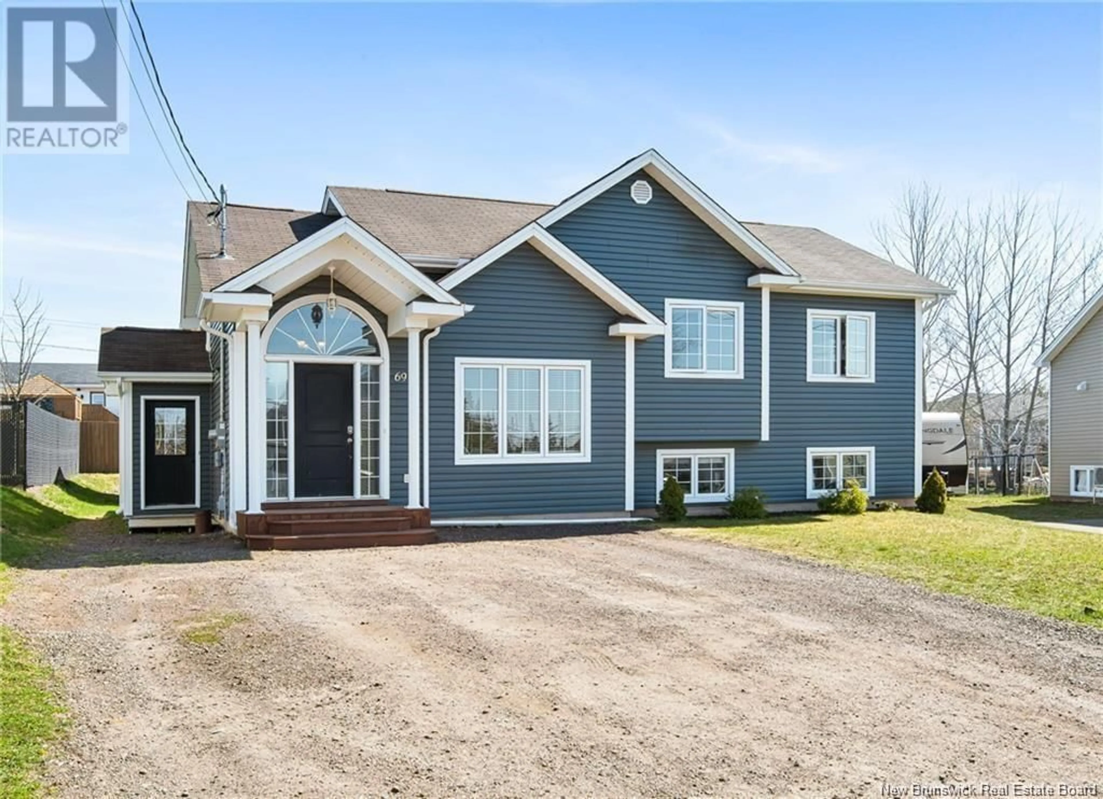Home with vinyl exterior material, street for 69 TILMON, Dieppe New Brunswick E1A5S3