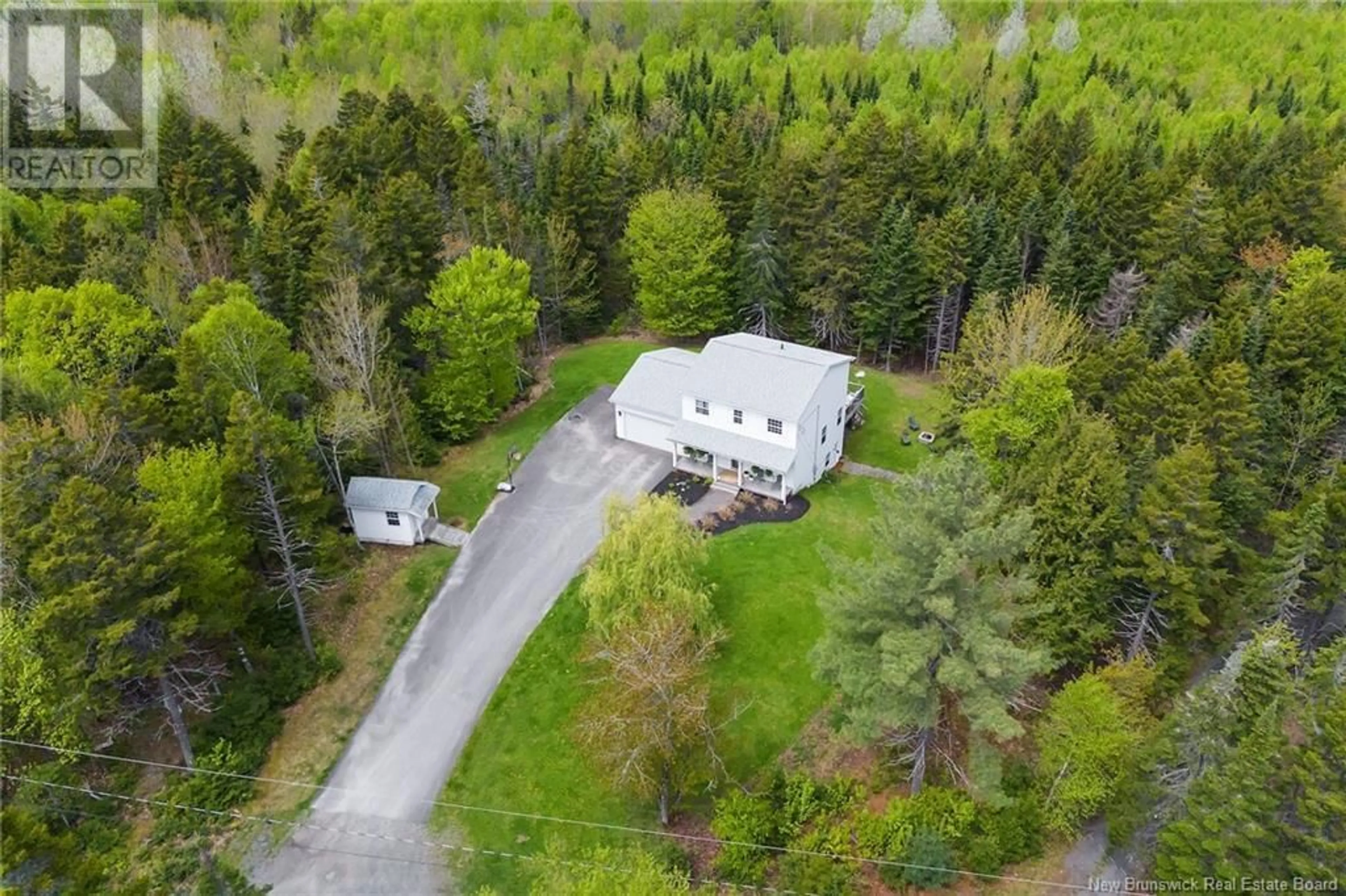 A pic from outside/outdoor area/front of a property/back of a property/a pic from drone, forest/trees view for 8 FIREWOOD LANE, Douglas New Brunswick E3G7X1