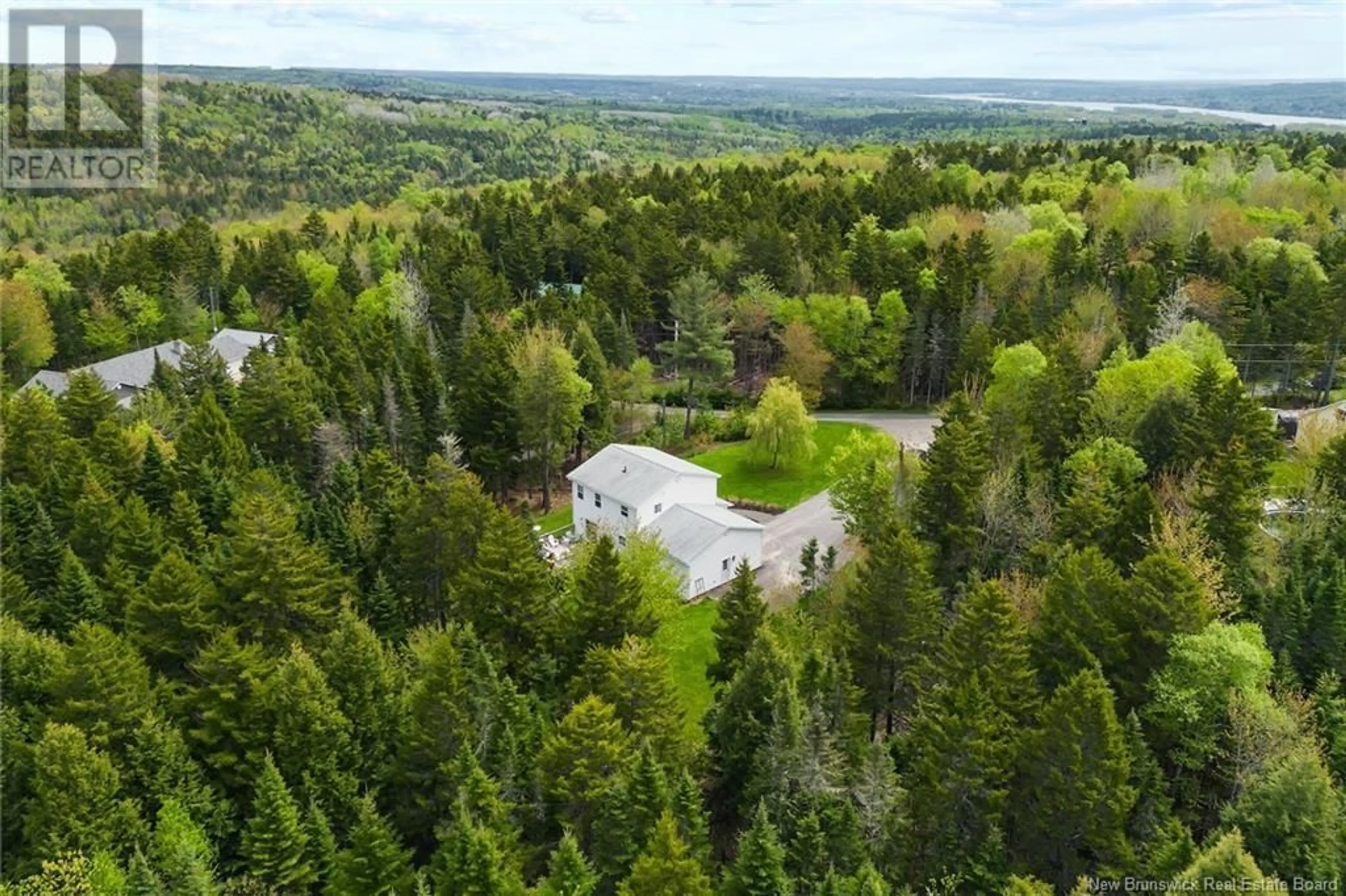 A pic from outside/outdoor area/front of a property/back of a property/a pic from drone, forest/trees view for 8 FIREWOOD LANE, Douglas New Brunswick E3G7X1