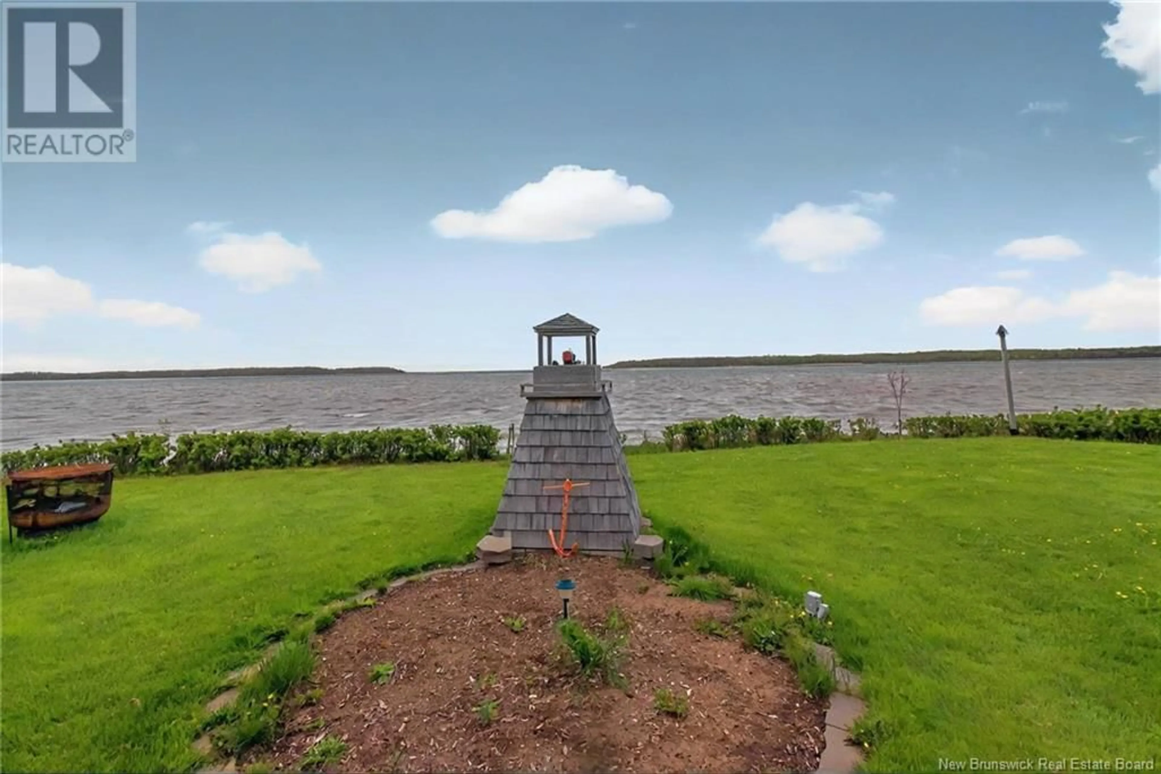 A pic from outside/outdoor area/front of a property/back of a property/a pic from drone, water/lake/river/ocean view for 14 DE LA MER BOULEVARD, Cocagne New Brunswick E4R2L7