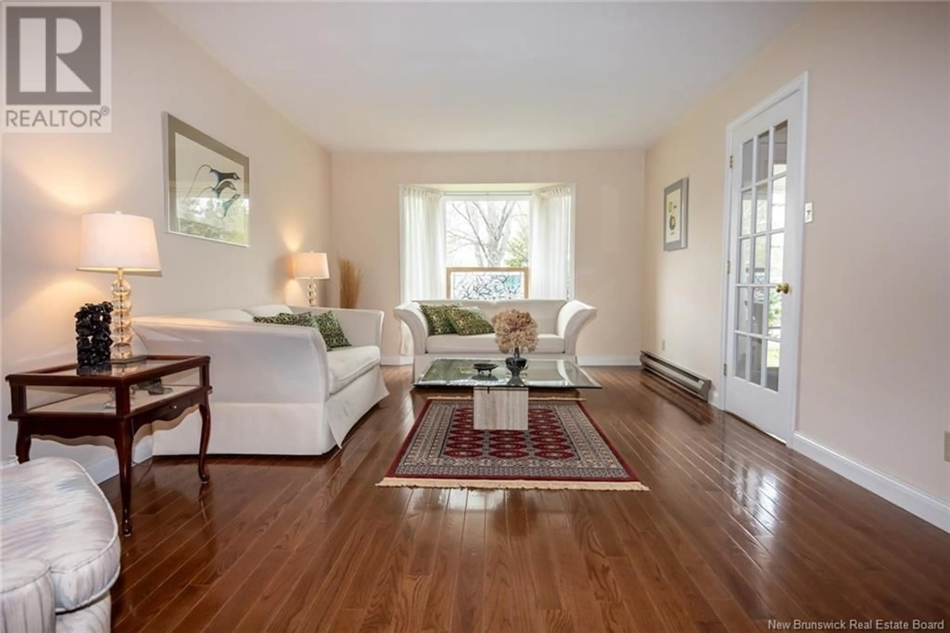 Living room with furniture, wood/laminate floor for 140 CASE STREET, Fredericton New Brunswick E3B7E2